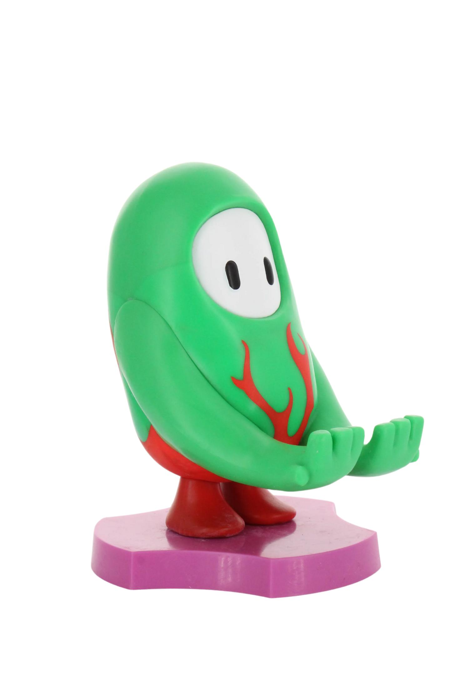 Una figurina verde di Fall Guys con dettagli rossi, su una base viola. Mani tese.
