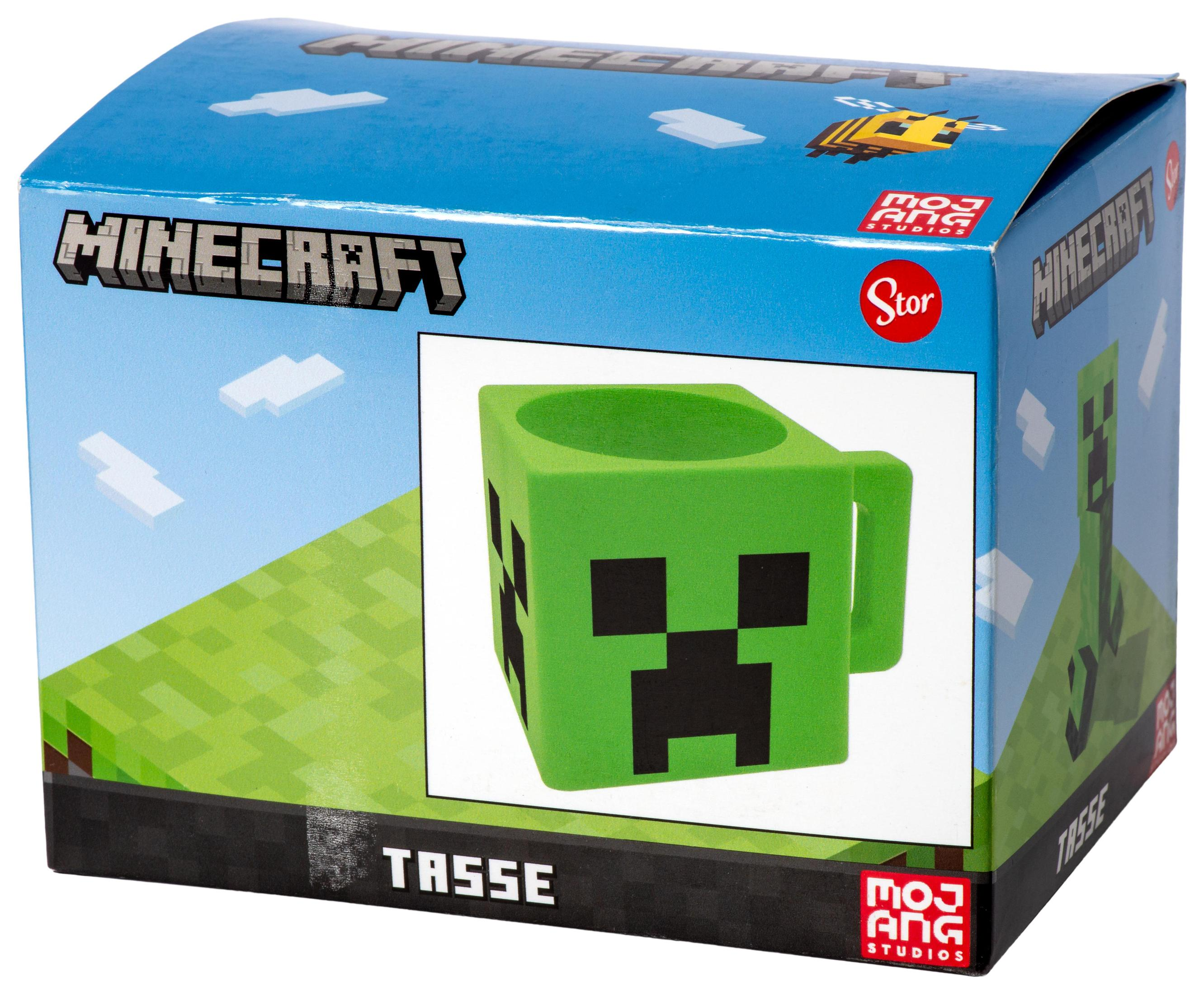 Minecraft Creeper-Tasse in einer Box mit grüner Tasse und blauem Himmel-Hintergrund.