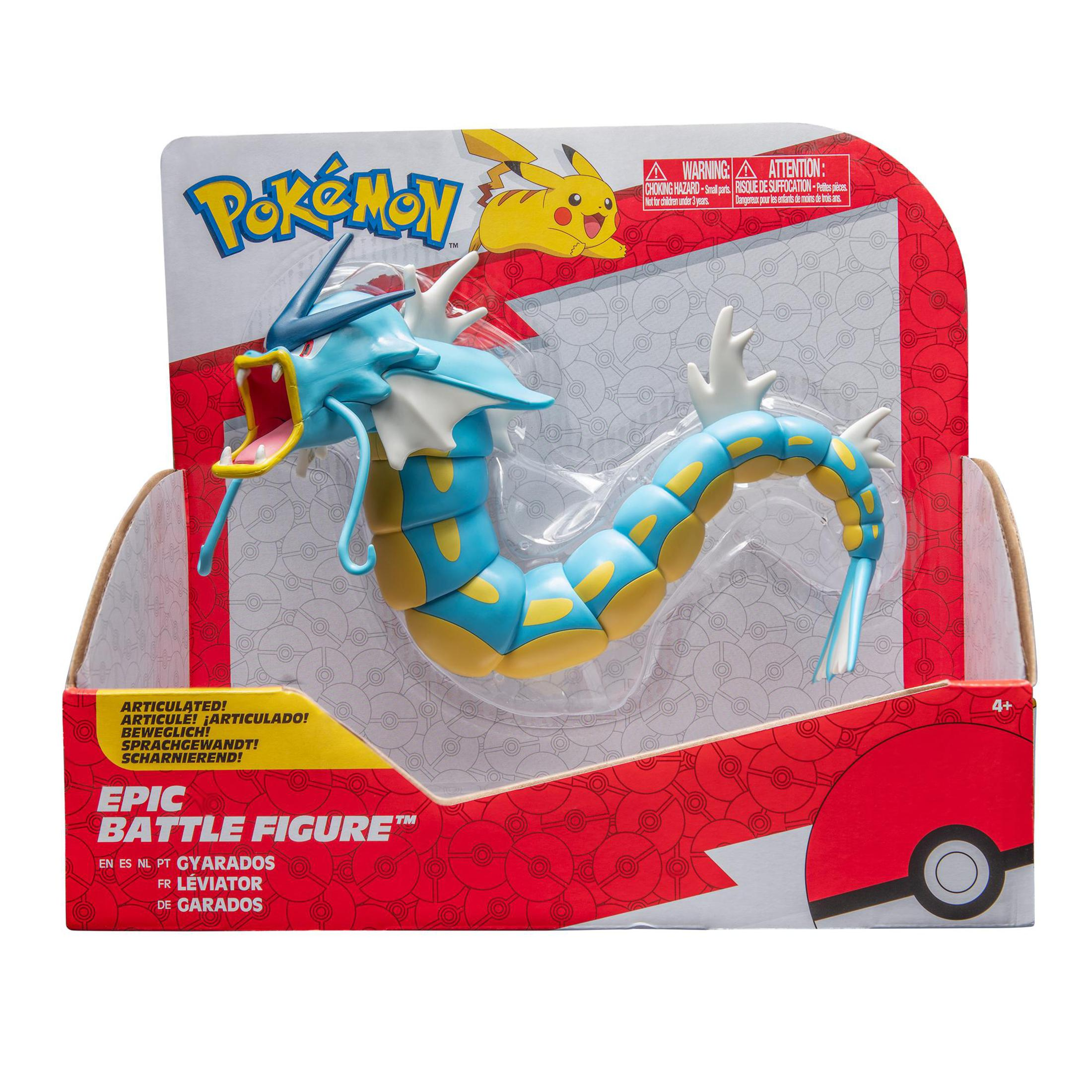 Pokemon-Spielzeug in der Box. Blaues und gelbes drachenartiges Wesen.