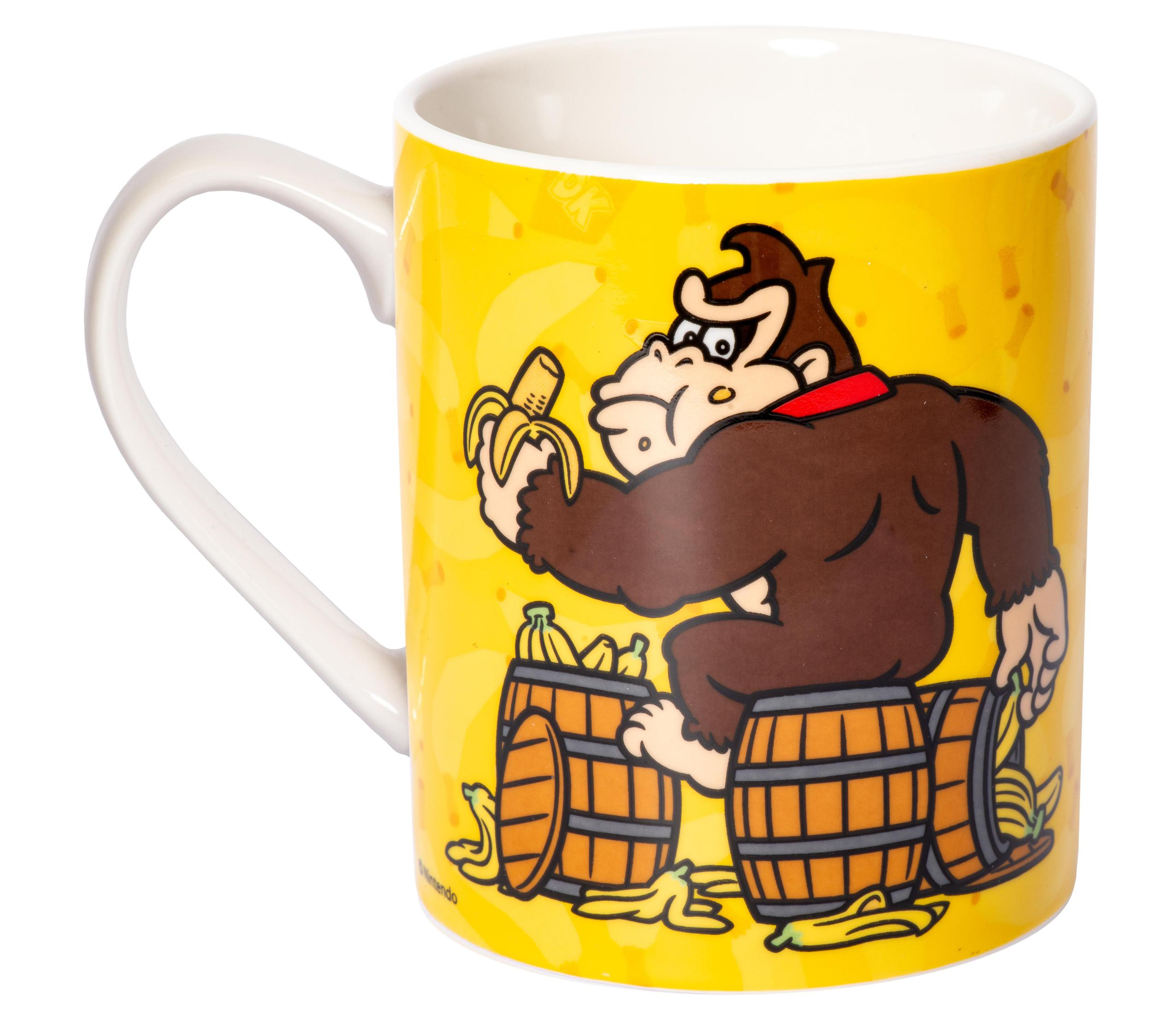Gelbe Donkey Kong-Tasse mit der Figur und Bananen darauf.