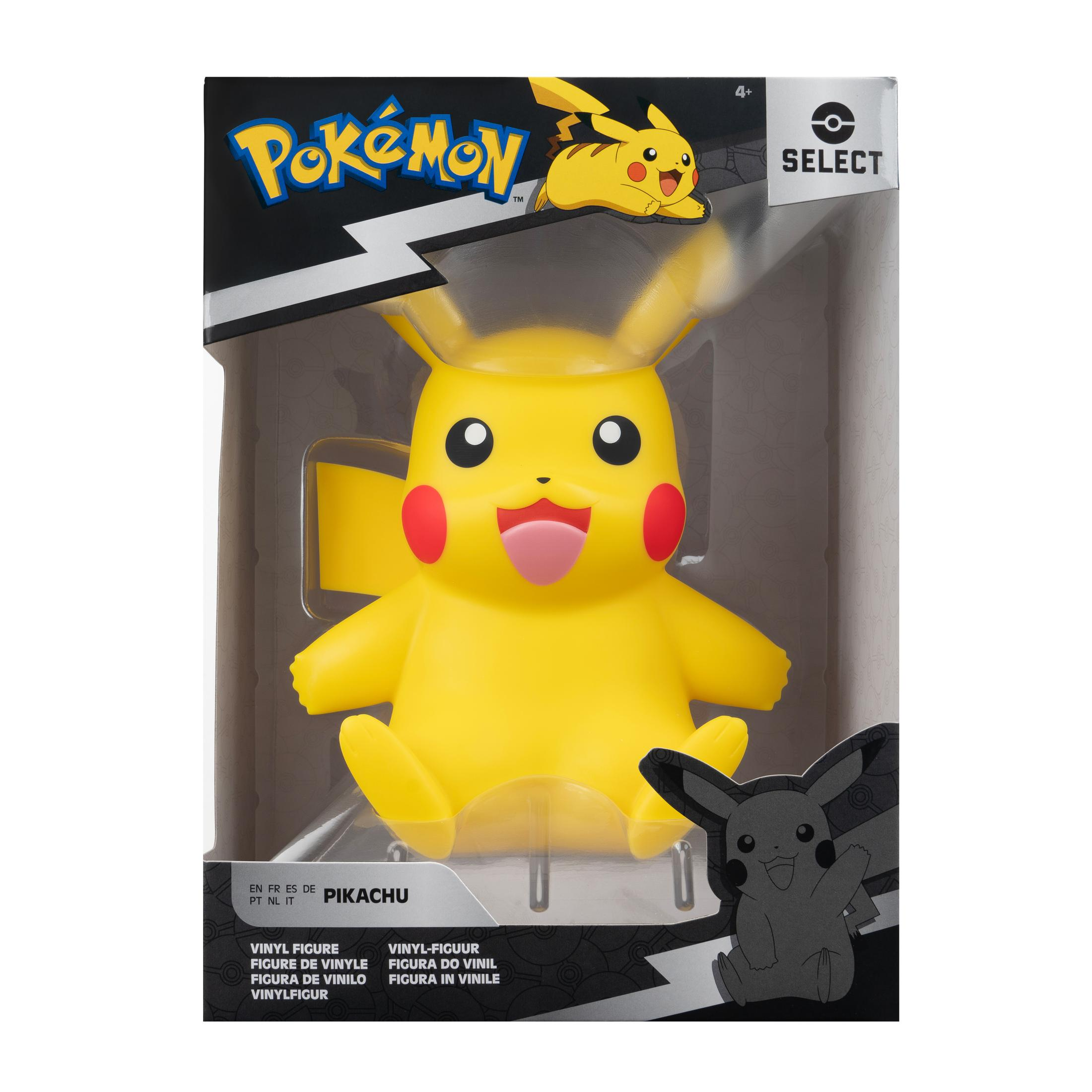 Pikachu-Spielfigur in einer Box, lächelnd, gelb mit roten Wangen, schwarzer Hintergrund.