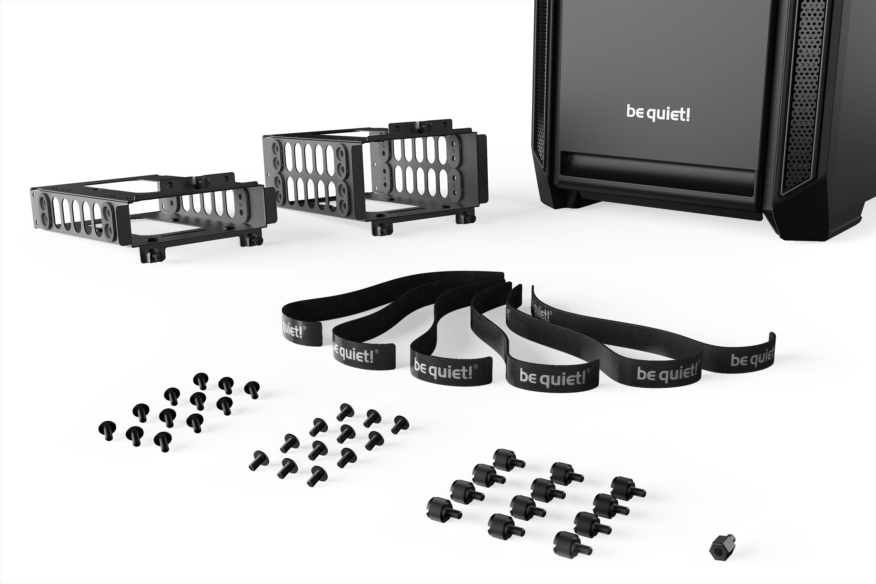 Czarna obudowa komputera i komponenty, w tym wsporniki, śruby i paski.
