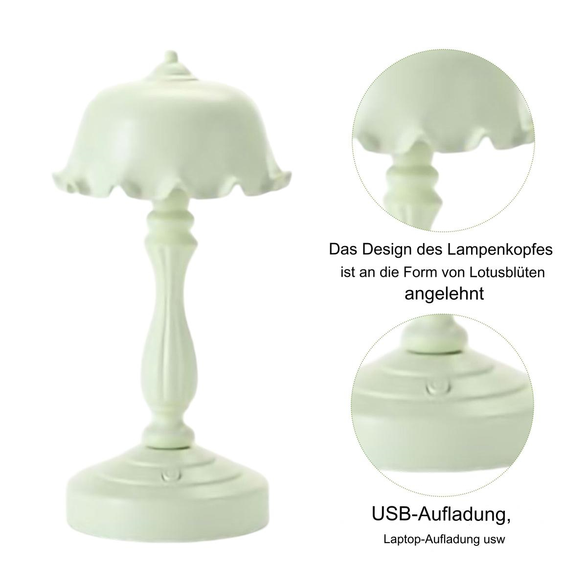 Grüne Tischlampe. Sockel und Stiel sind weiß. Der Schirm ähnelt einer Blume.