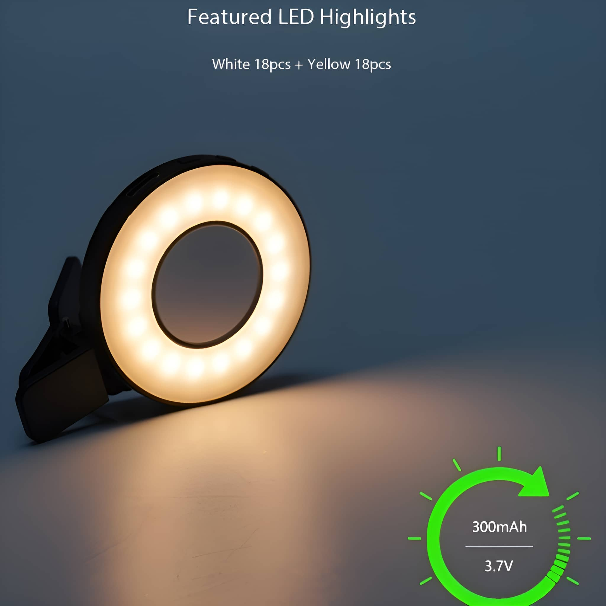 Weißes LED-Ringlicht mit schwarzem Clip und grünem Akkusymbol auf weißem Hintergrund.