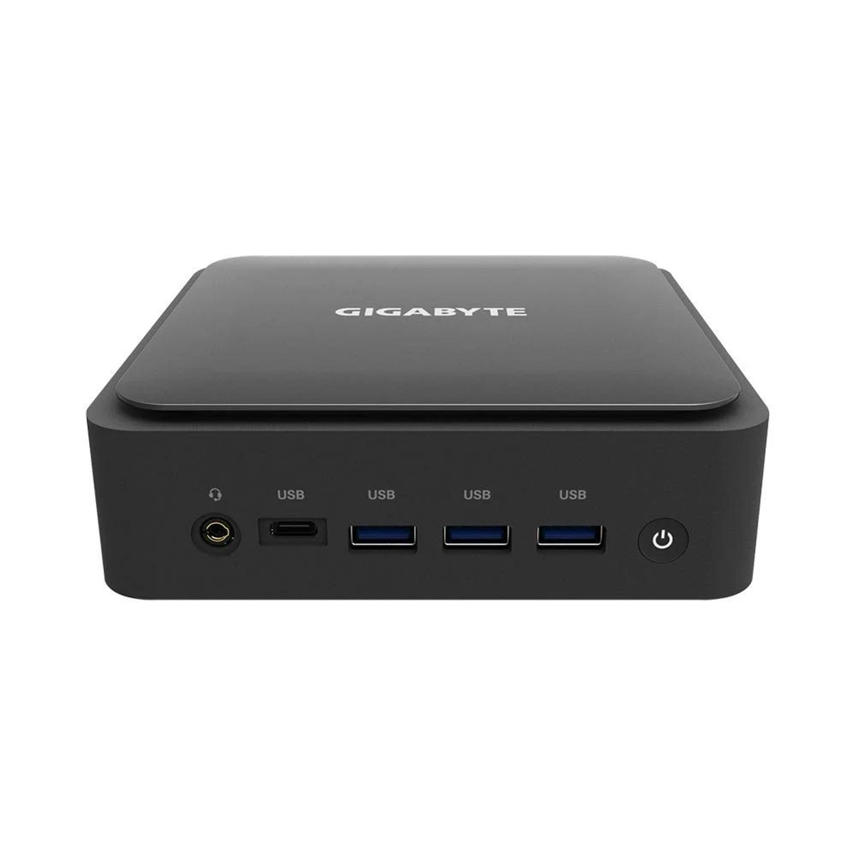 Mini-PC Gigabyte negro. Vista frontal con puertos USB, botón de encendido y conector para auriculares.