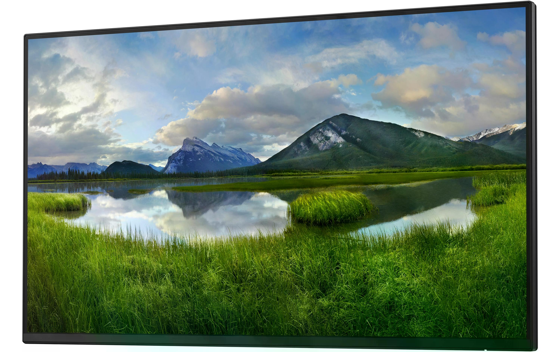Monitor komputera wyświetlający malowniczy krajobraz z górami, jeziorem i zieloną trawą.