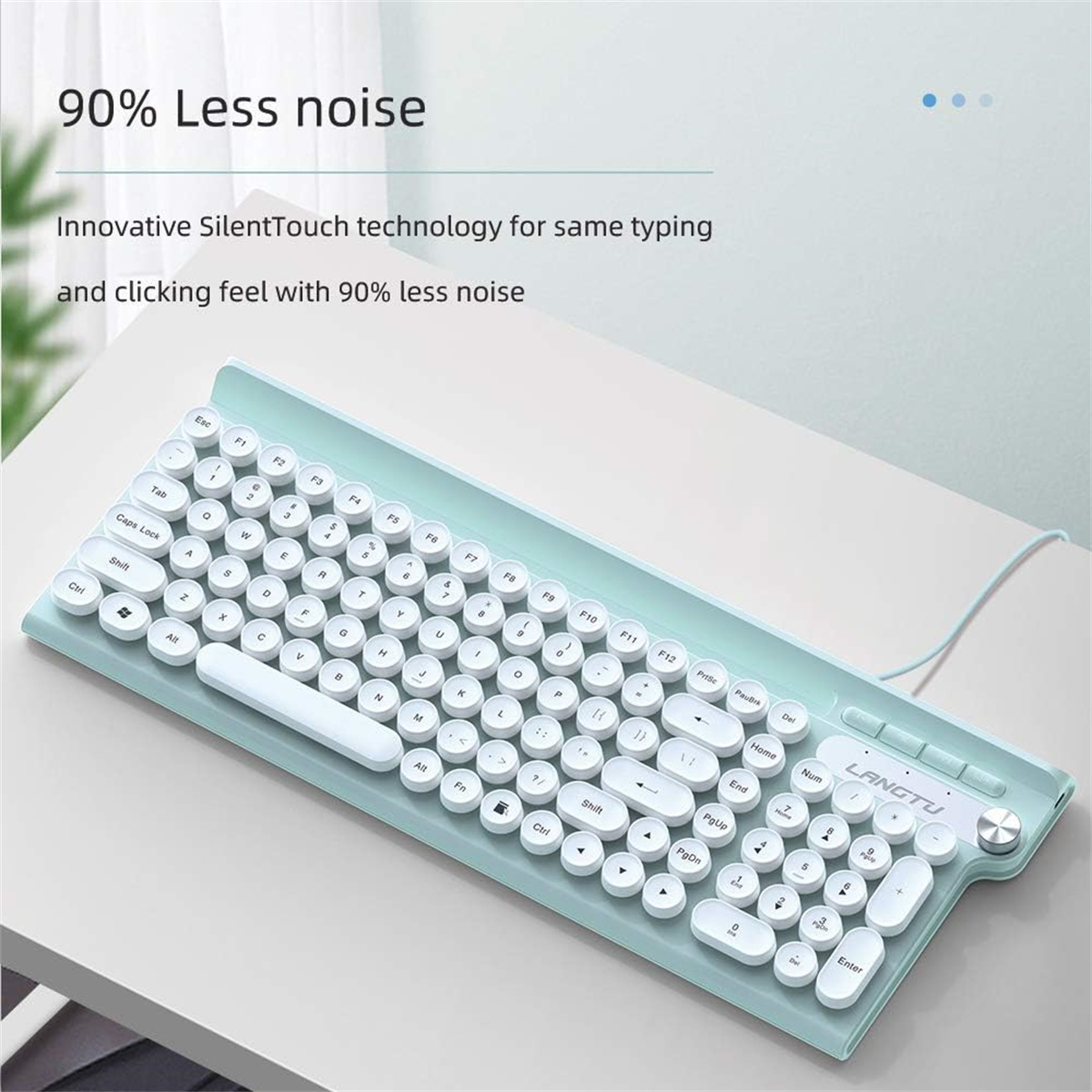 Eine mintgrüne, ergonomische Tastatur mit weißen, runden Tasten. Sie liegt auf einem weißen Schreibtisch.