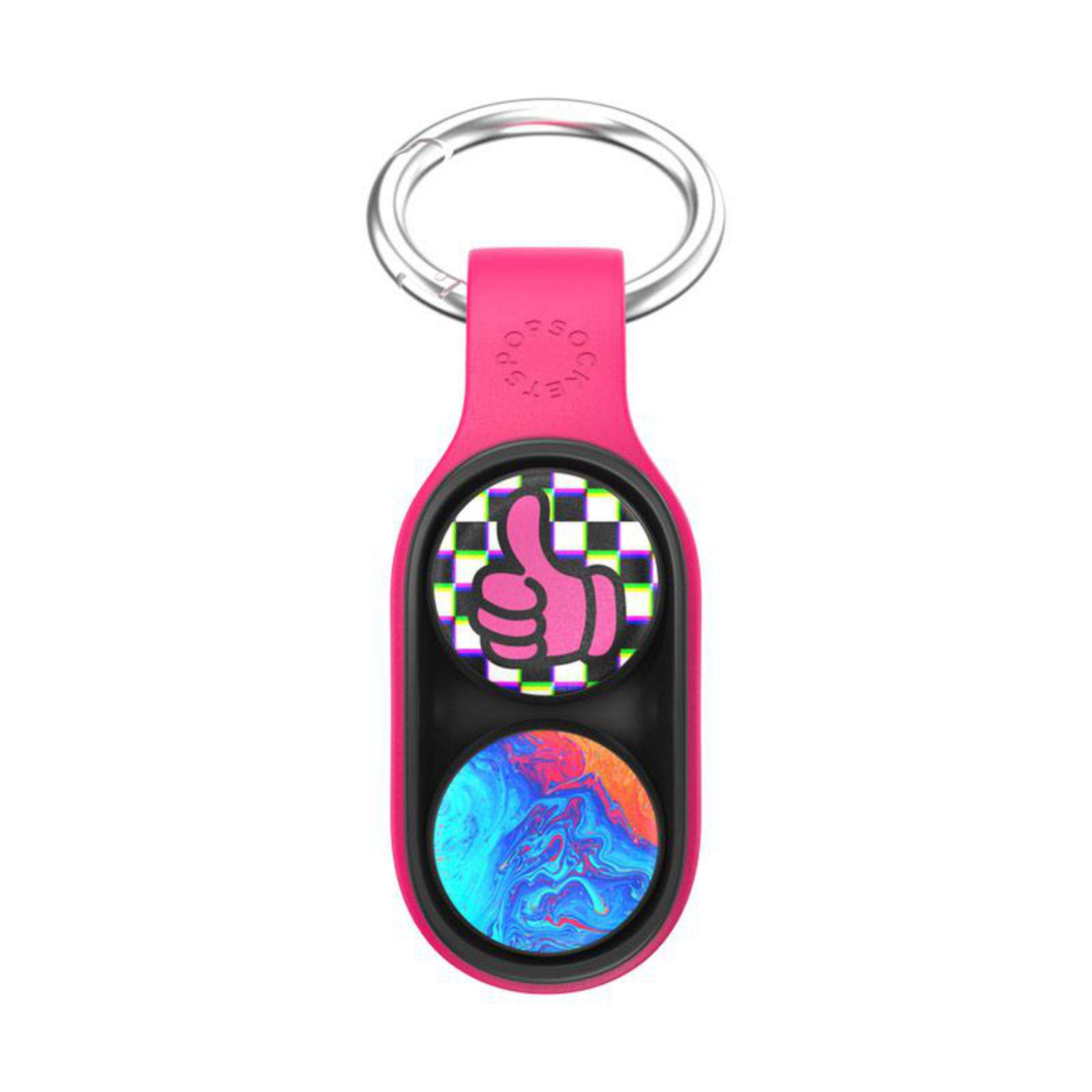 Etichetta PopSockets rosa con anello argentato e due pulsanti con pollice su e motivi a vortice.