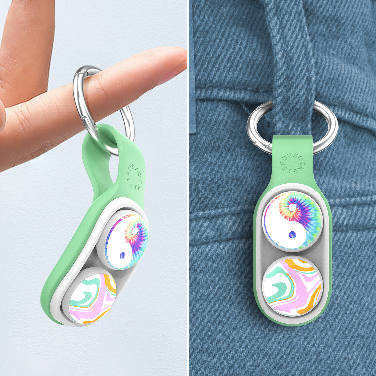 Mano che tiene un portachiavi verde vicino a una tasca dei jeans. Portachiavi con Yin-Yang e spirale.