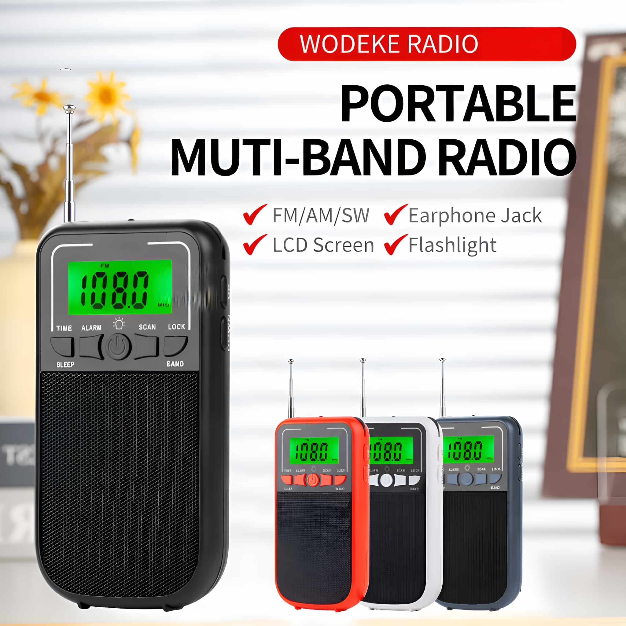 Ein kleines, tragbares Radio in Schwarz und Rot mit Bildschirm, Antenne und Knöpfen.
