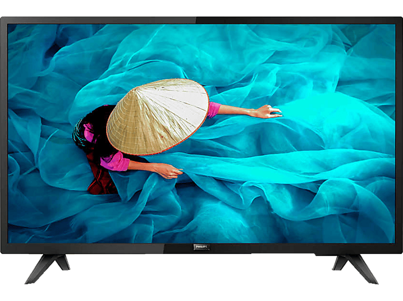 Una pantalla de TV muestra a una persona con sombrero cónico, brazos extendidos, en una escena de tela azul.