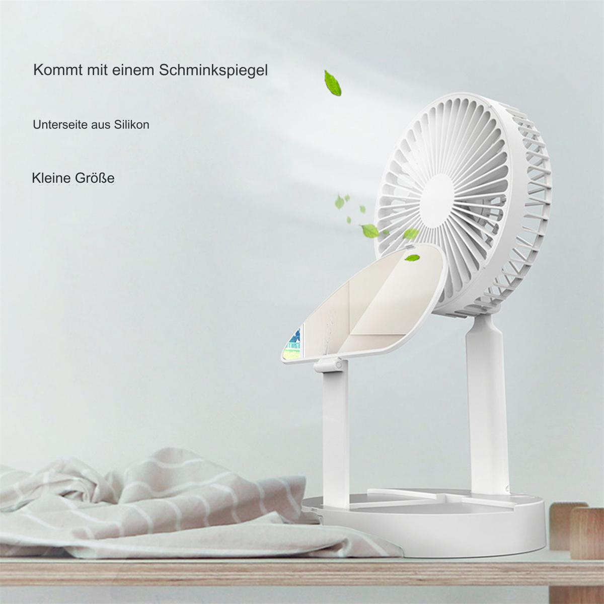 Ein weißer tragbarer Ventilator mit Spiegel, kleine Größe. Es steht auf einem Holztisch mit Blättern.