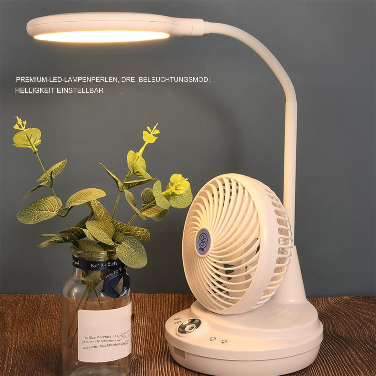 Weiße Schreibtischlampe mit Ventilator und einer Vase mit grünen Blättern. Die Lampe hat einen flexiblen Arm.