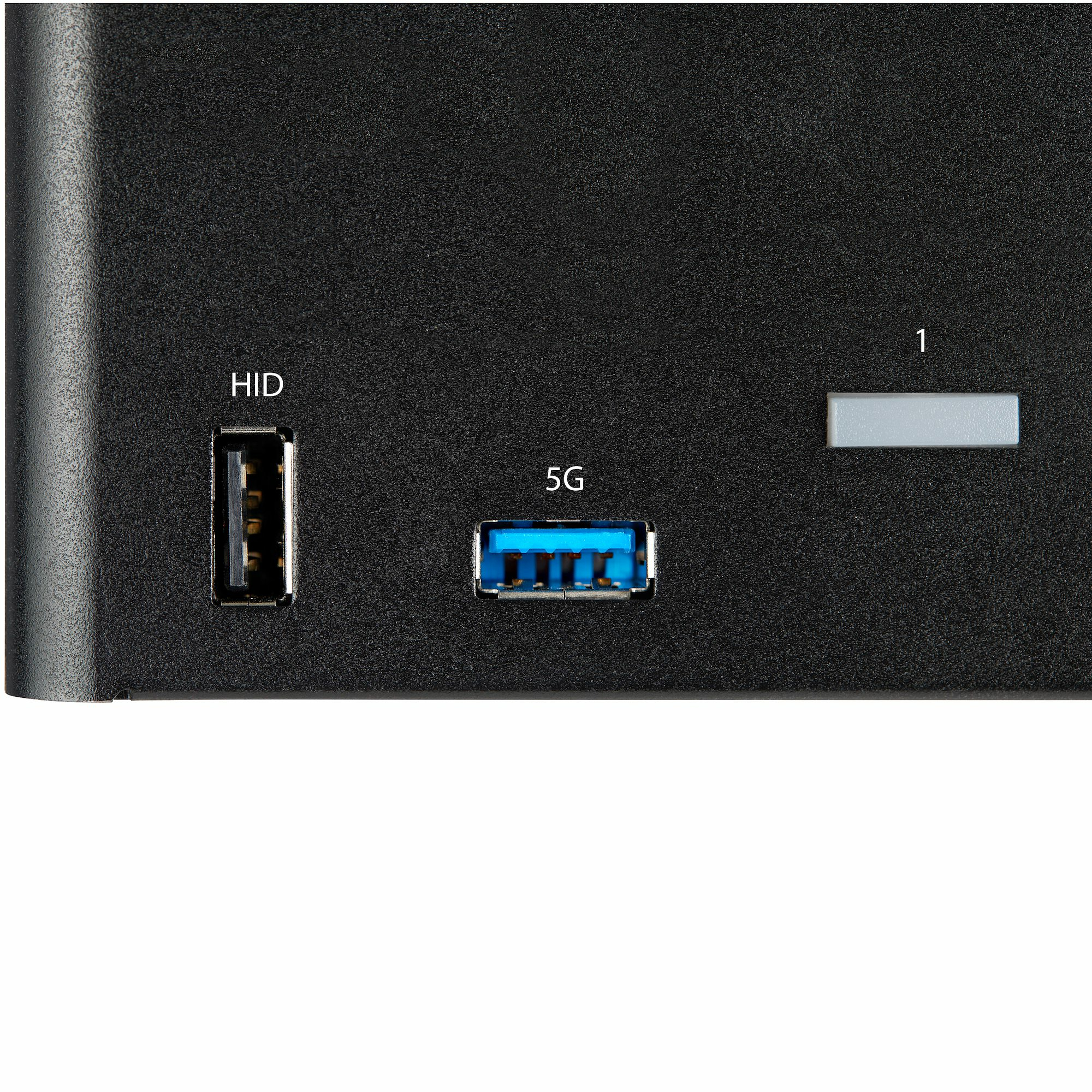 Nahaufnahme eines schwarzen Geräts mit USB-Anschlüssen, beschriftet mit 'HID' und '5G'. Ein grauer Port ist auch sichtbar.