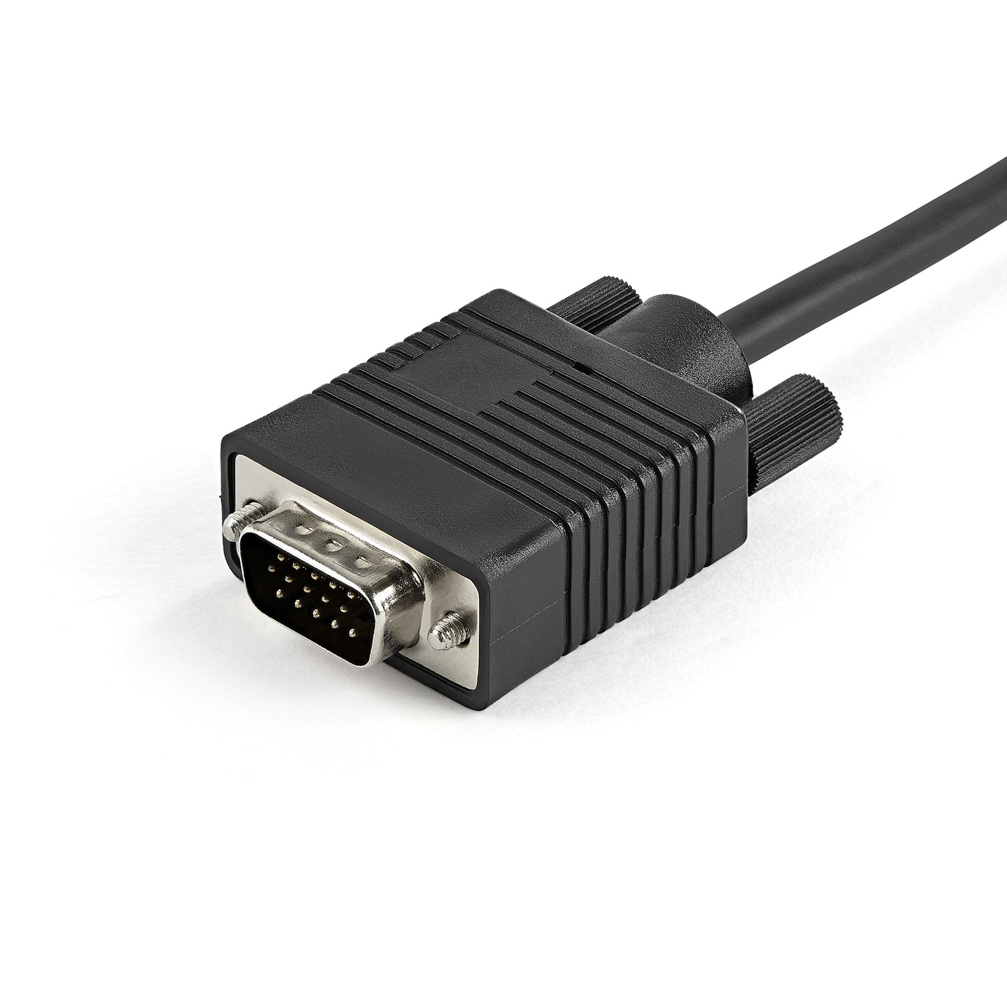 Een zwarte VGA-kabelconnector met pinnen ligt op een wit oppervlak.
