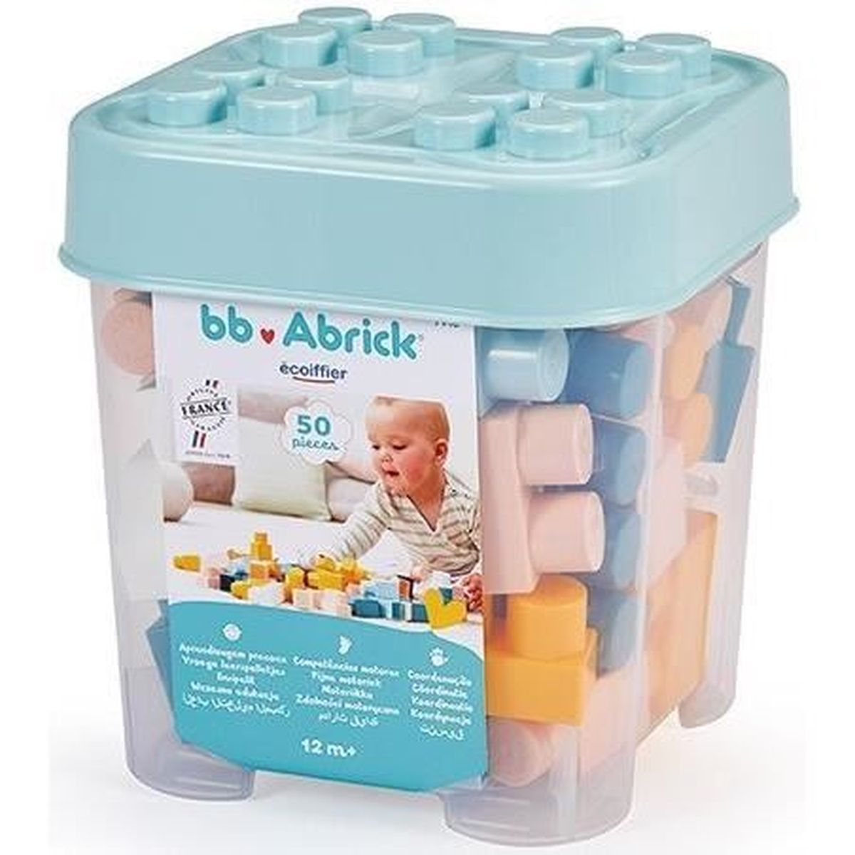 Mattoncini colorati in scatola trasparente con coperchio, un bambino gioca.