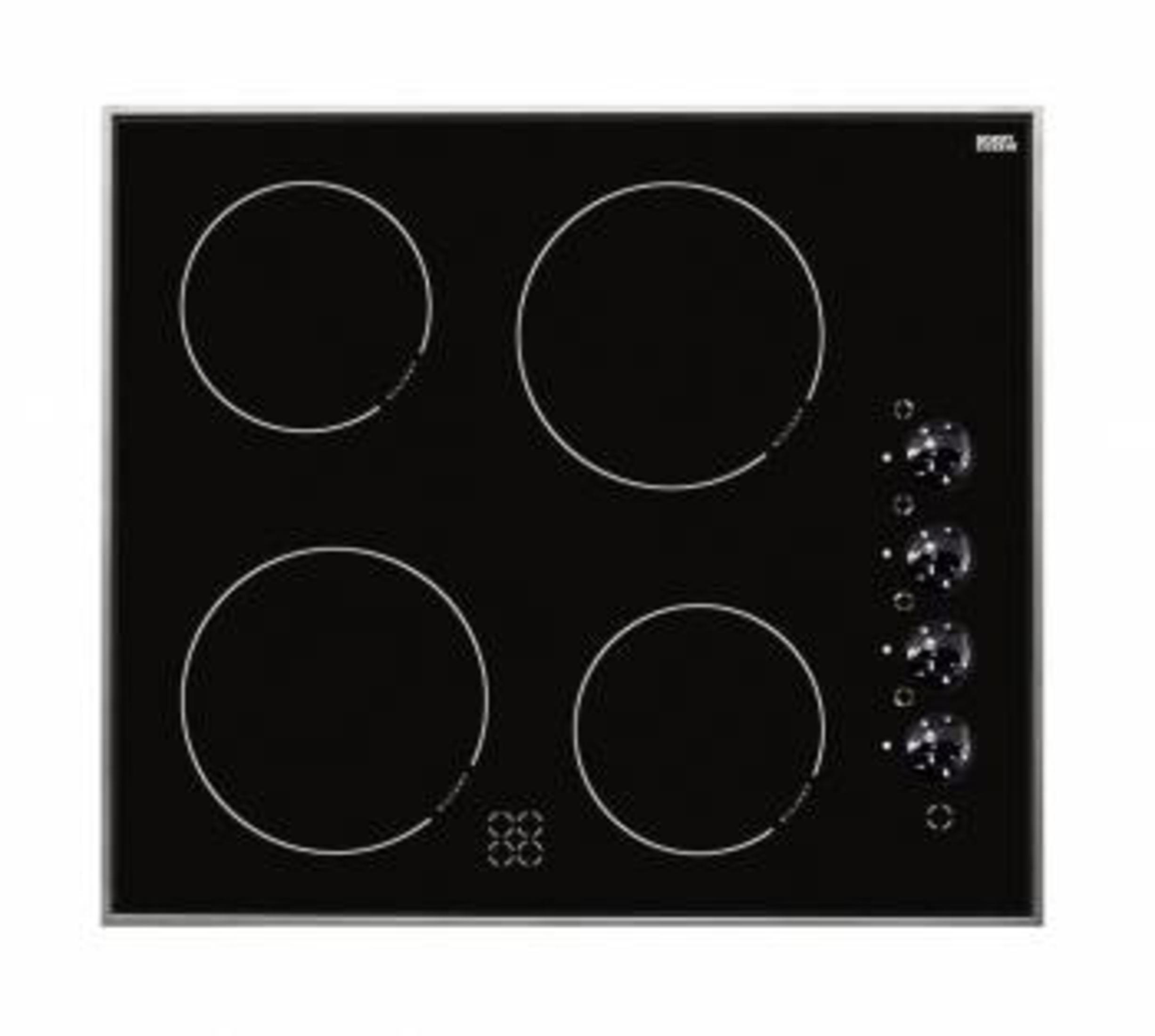 Czarna płyta grzewcza z czterema białymi okręgami dla palników i pokrętłami po prawej stronie.