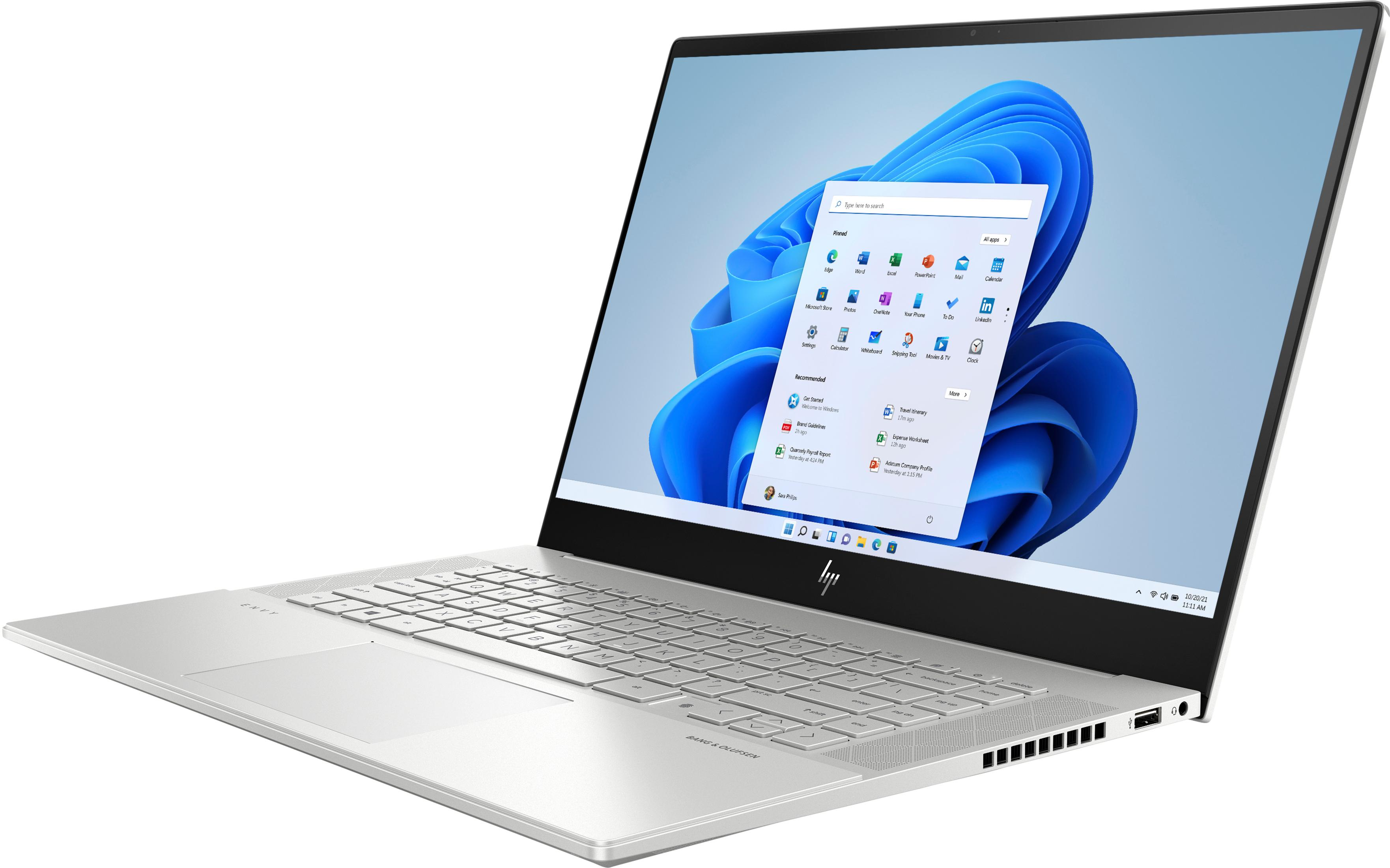 Silberner Laptop geöffnet, zeigt Windows 11 Oberfläche. Tastatur, Trackpad und Bildschirm.