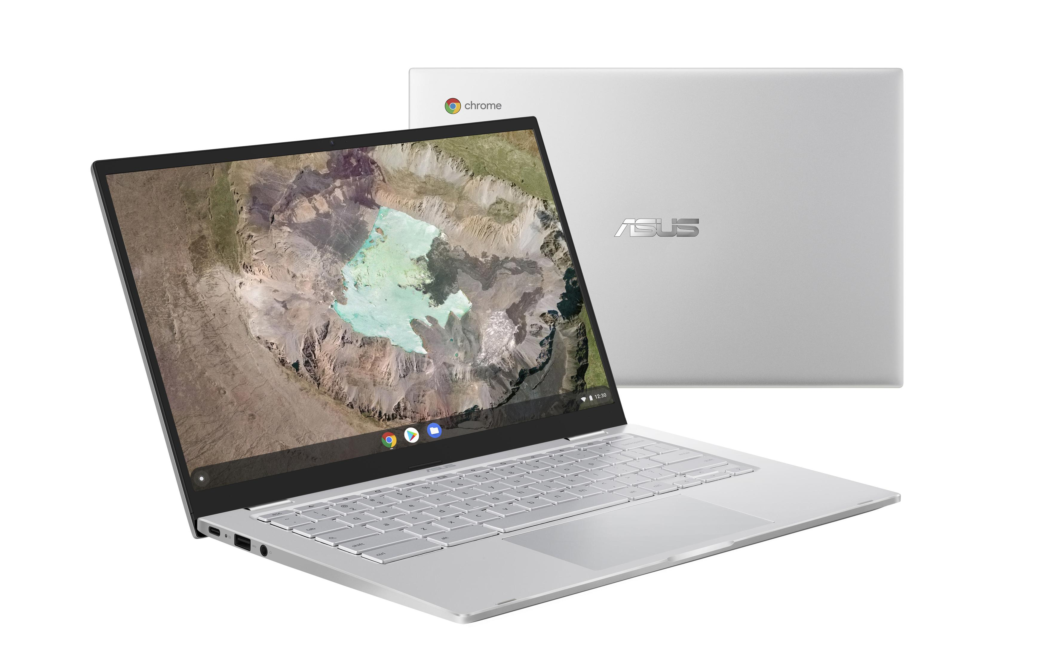 Silberner Laptop, zeigt bunten Hintergrund. Der Laptop ist geöffnet.