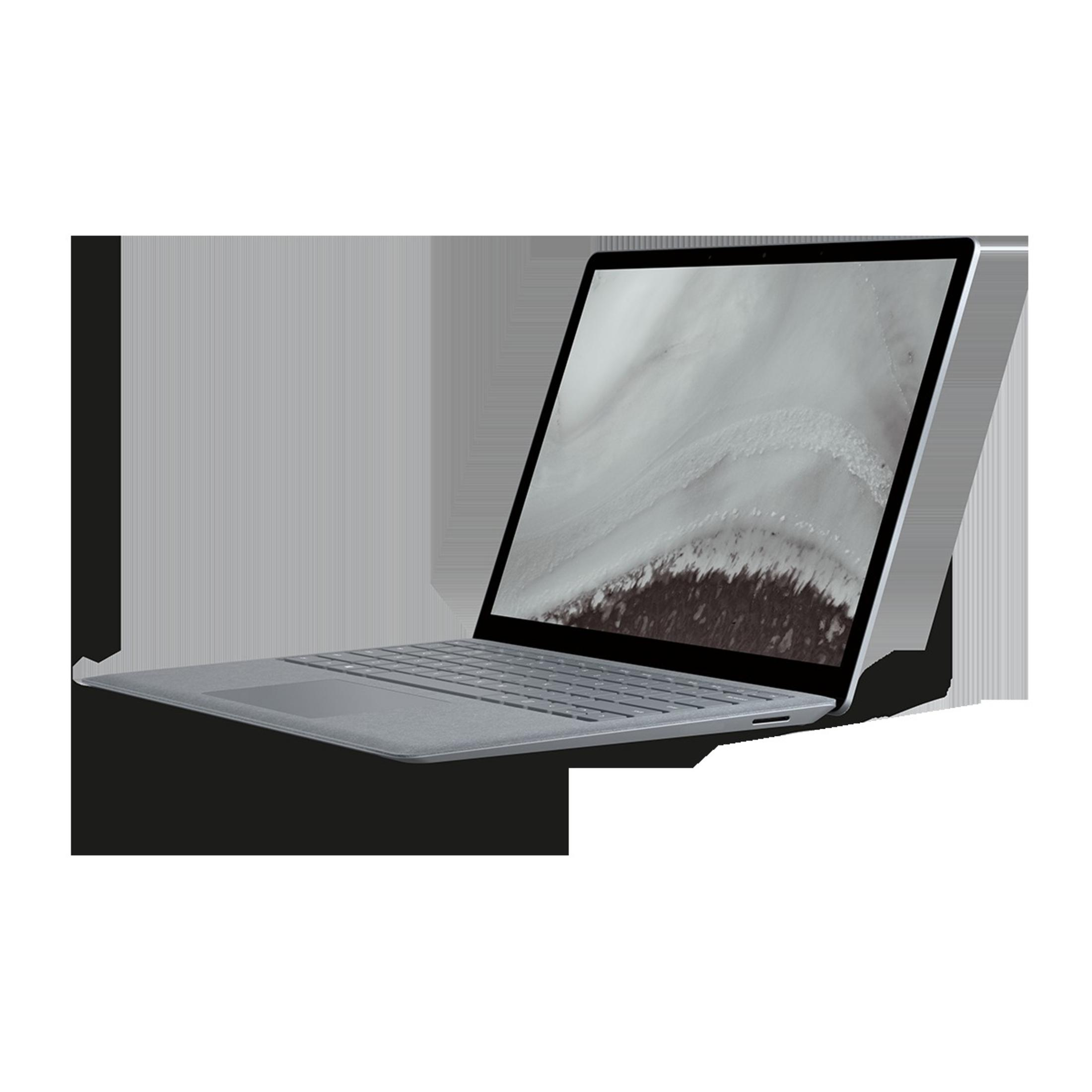 Silberner Laptop mit hellfarbiger Stofftastatur und einem Bildschirm mit schneebedeckter Landschaft.
