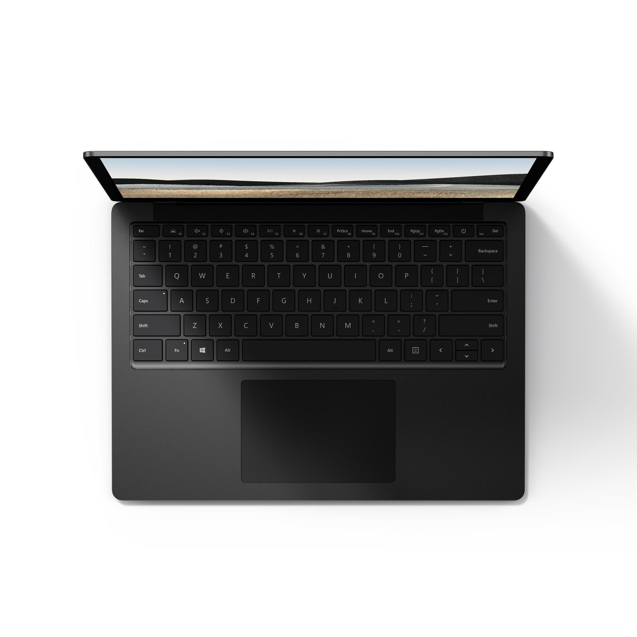 Schwarzer Laptop auf Weiß. Tastatur sichtbar, Bildschirm zeigt Landschaft.