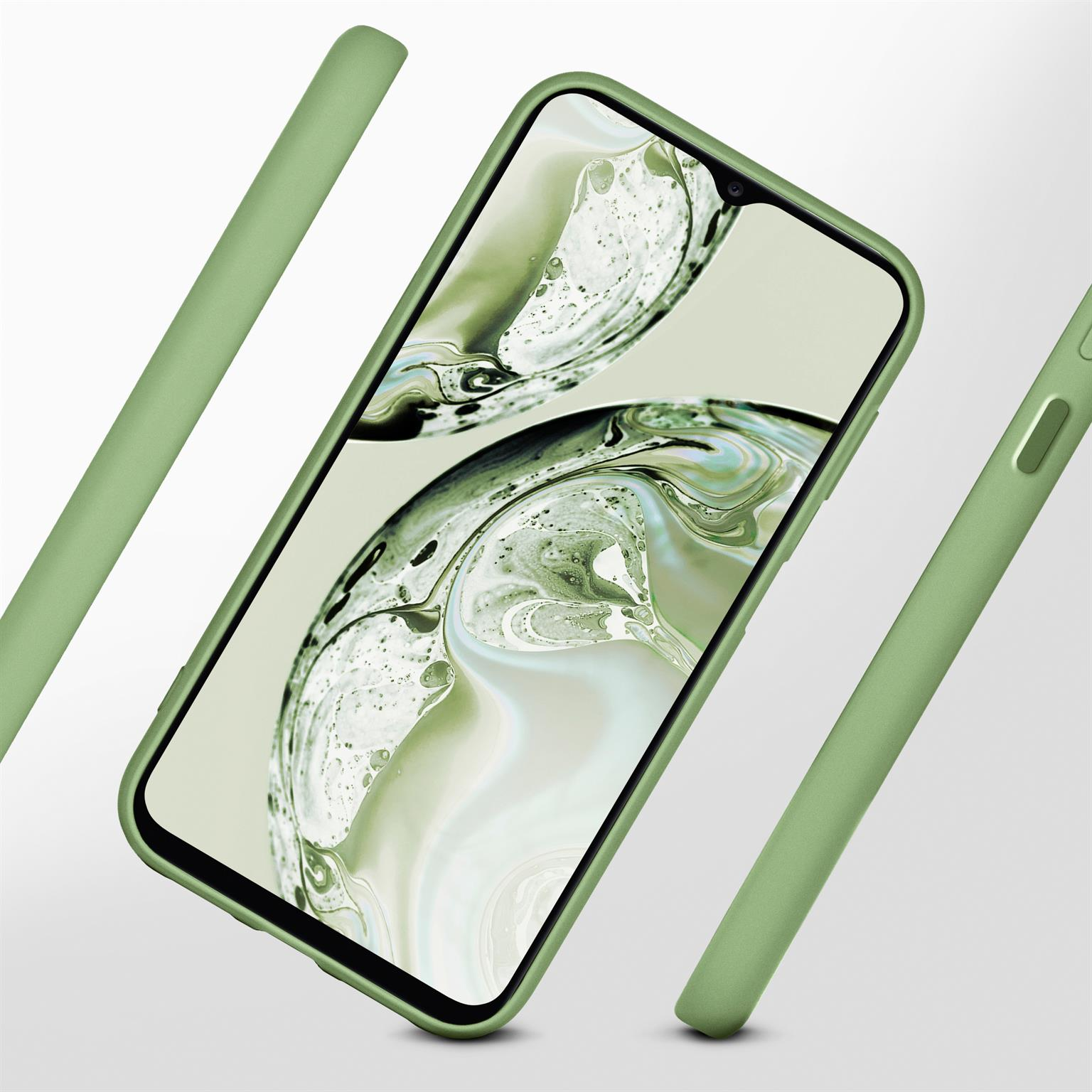 Grüne Handyhülle mit einem Telefon darin. Zwei zusätzliche Gehäuseteile umgeben das Telefon.