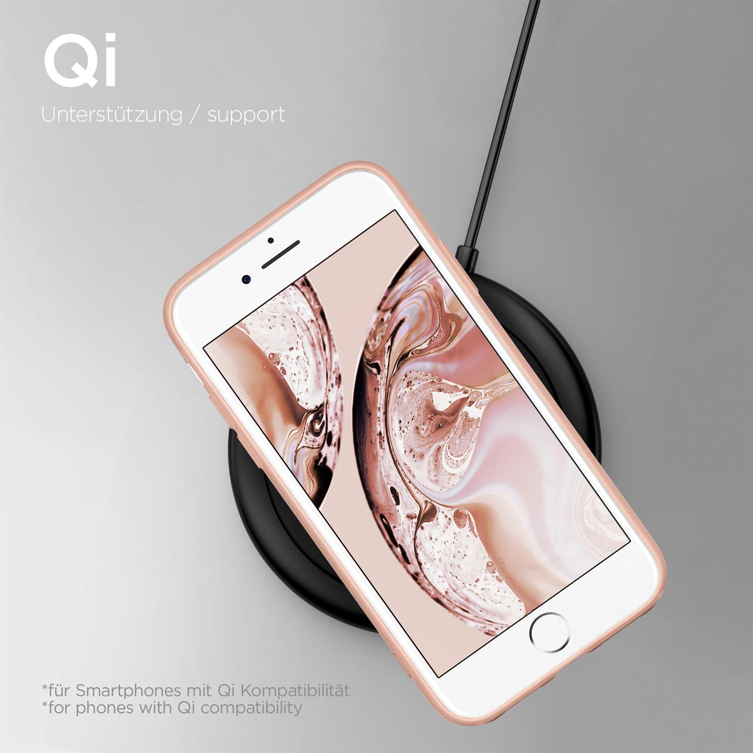 Ein weißes Telefon in einer rosa Hülle, das auf einem schwarzen kabellosen Ladegerät geladen wird.