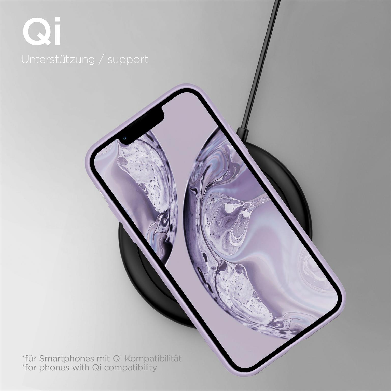 Telefon auf einem kabellosen Ladegerät. Das Telefon hat einen lila Hintergrund auf dem Bildschirm. Das Ladegerät ist schwarz.