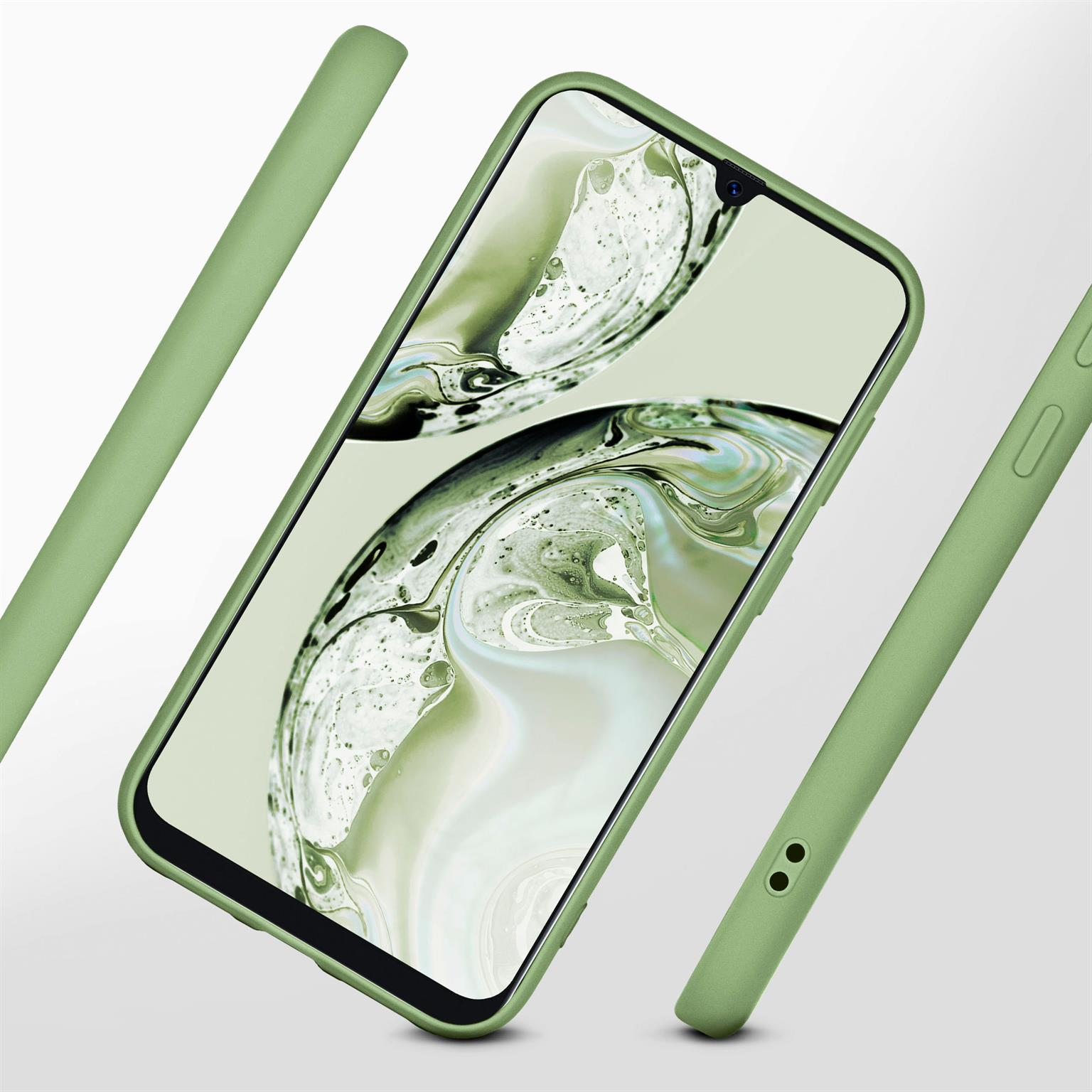 Grüne Handyhülle mit einem Telefon darin. Zwei weitere Gehäuseteile sind ebenfalls sichtbar.