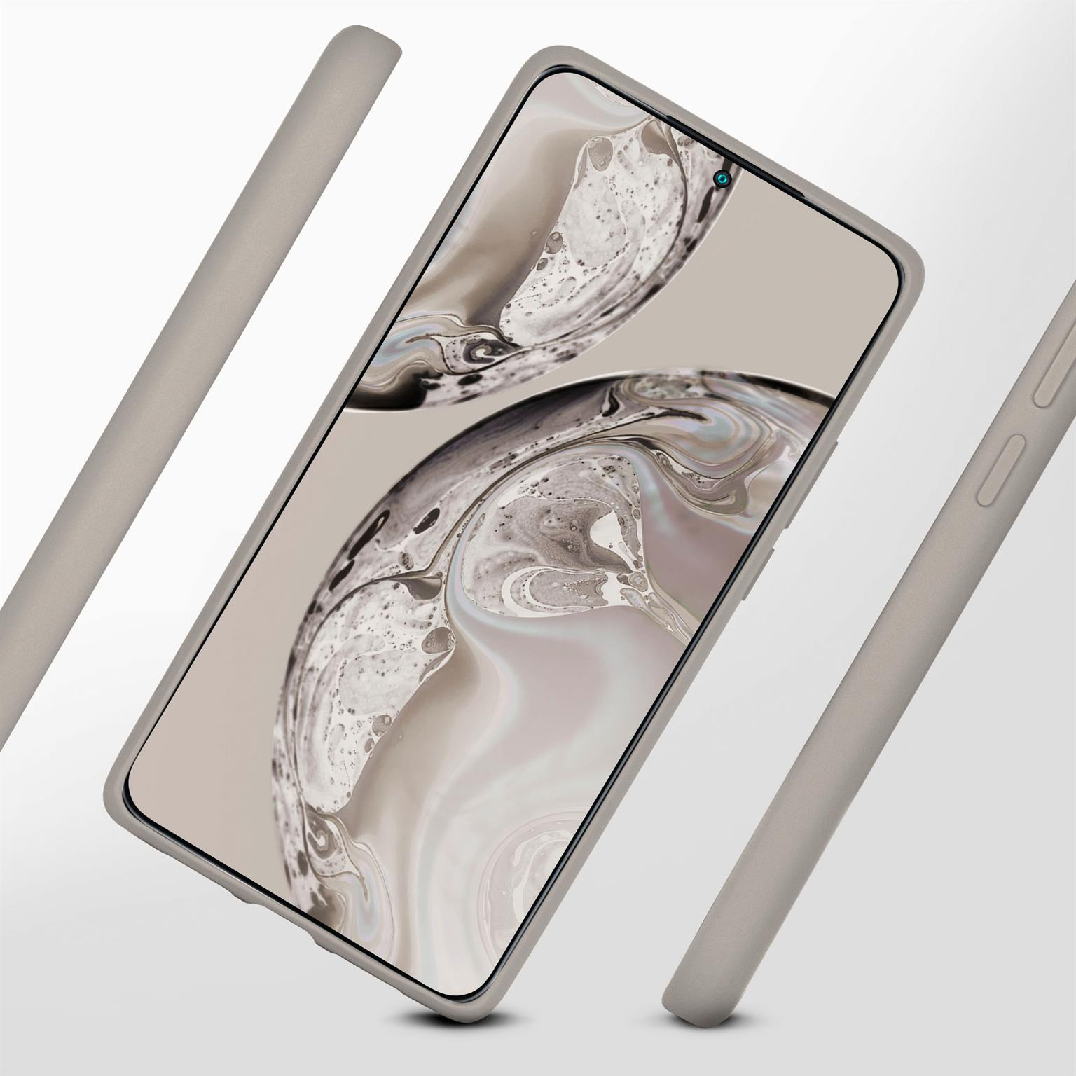 Ein Telefon in einer hellgrauen Hülle und zwei weitere Teile der Hülle an der Seite. Das Telefon ist im Fokus.