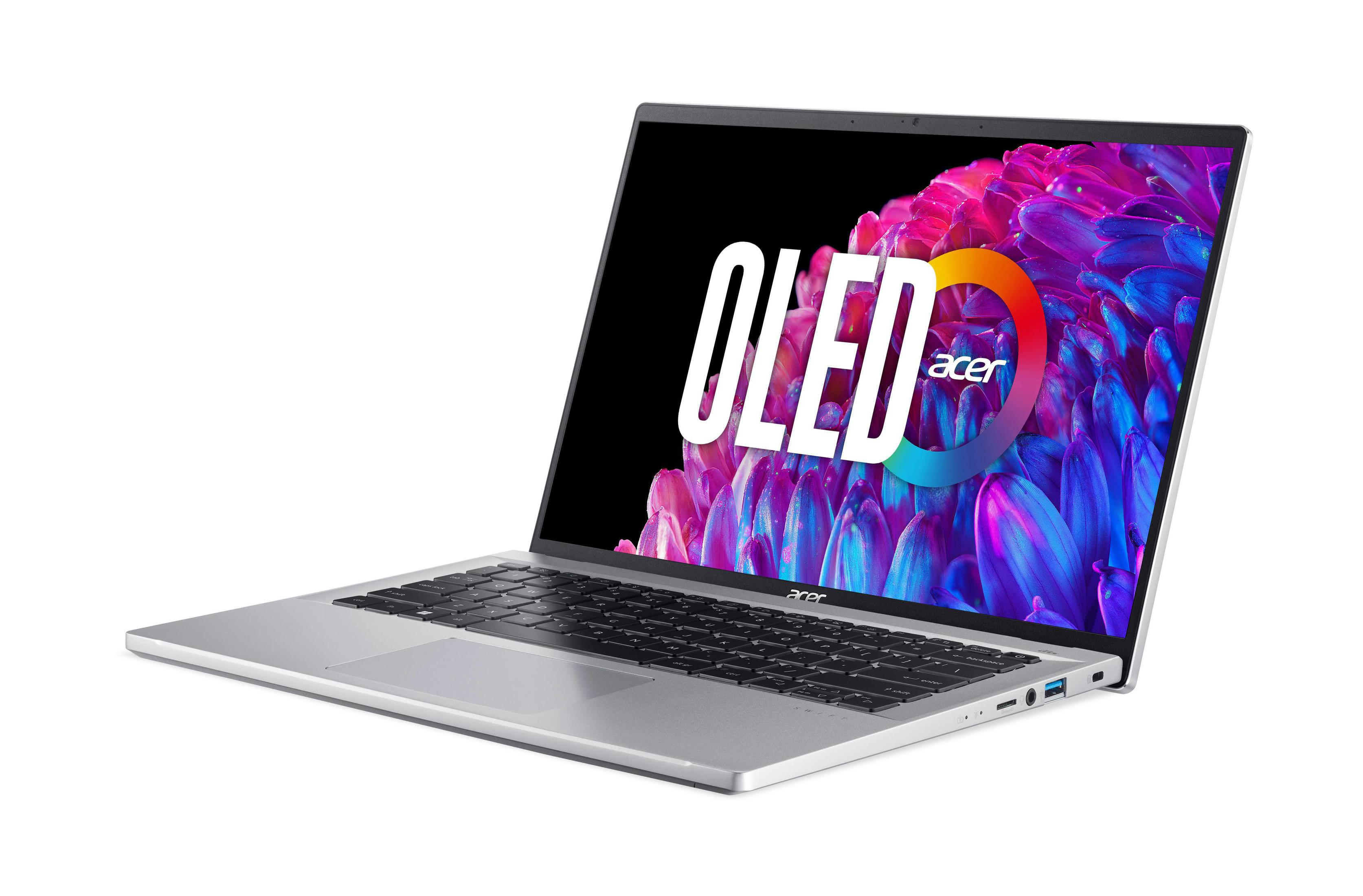 Laptop argentato aperto, mostra schermo OLED con logo Acer. Sfondo bianco.