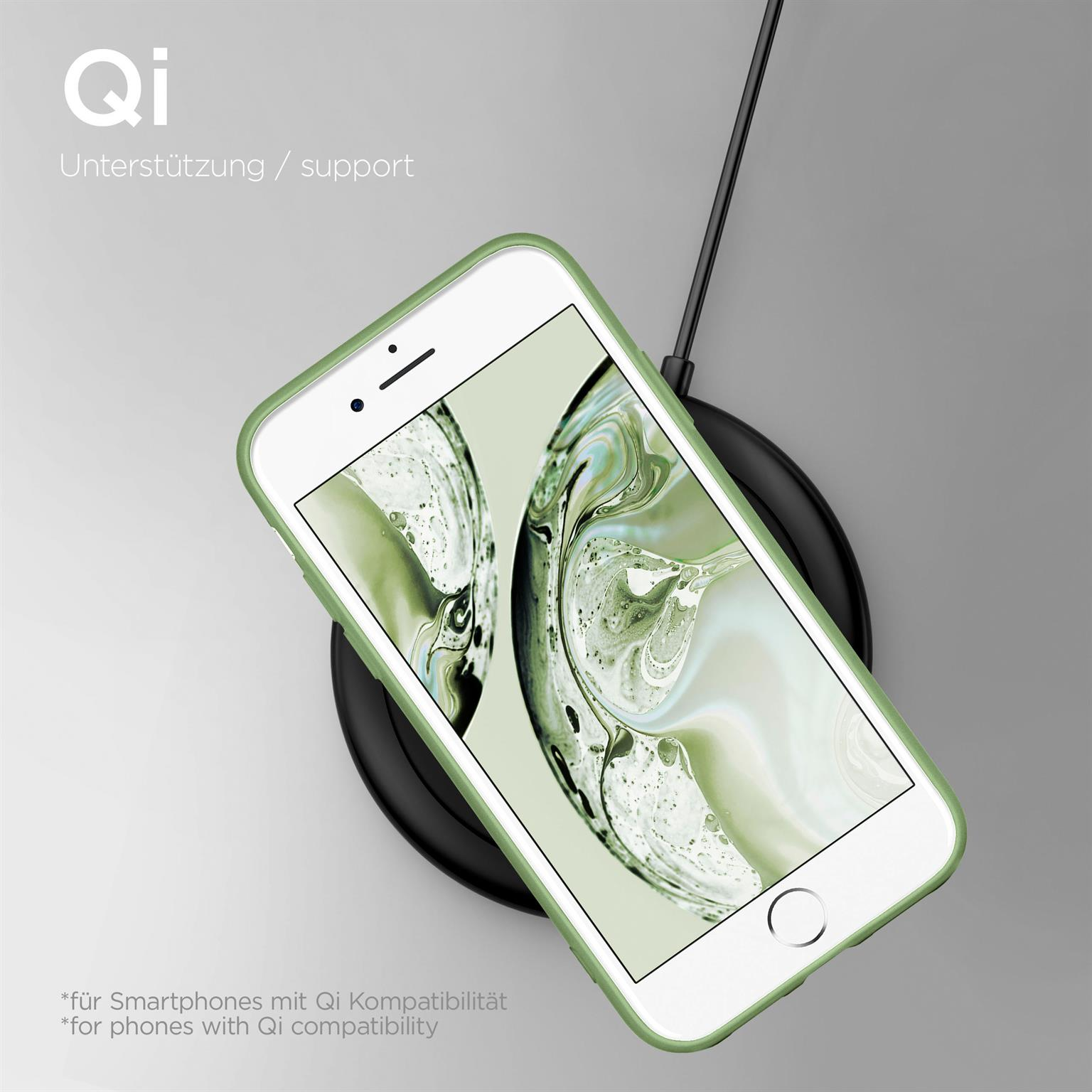 Grüne Handyhülle mit Telefon auf schwarzer Ladestation. Der Bildschirm zeigt ein Bild.