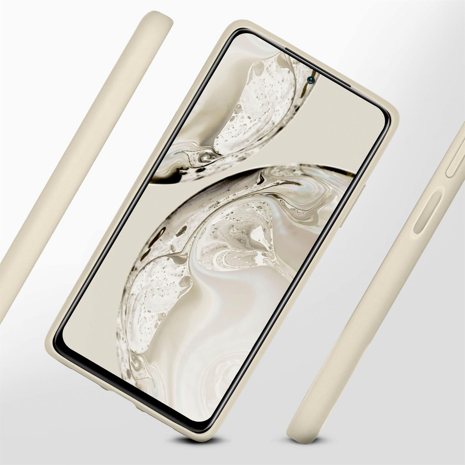 Beiges Telefon in beiger Hülle. Zwei zusätzliche Gehäuseteile werden im Hintergrund angezeigt.