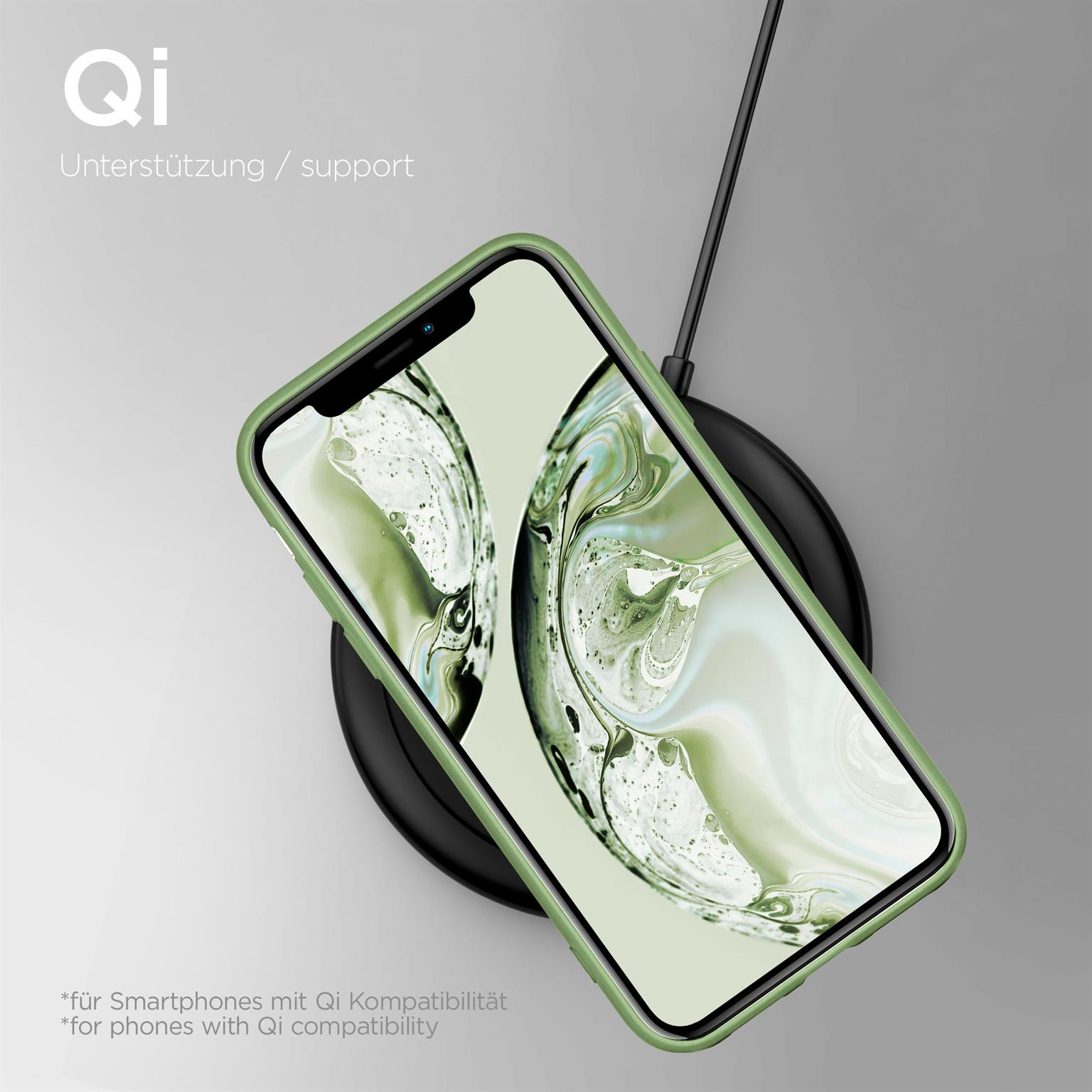 Ein Telefon auf einem kabellosen Ladegerät. Das Telefon hat eine grüne Hülle. Ein schwarzes Kabel führt vom Ladegerät weg.