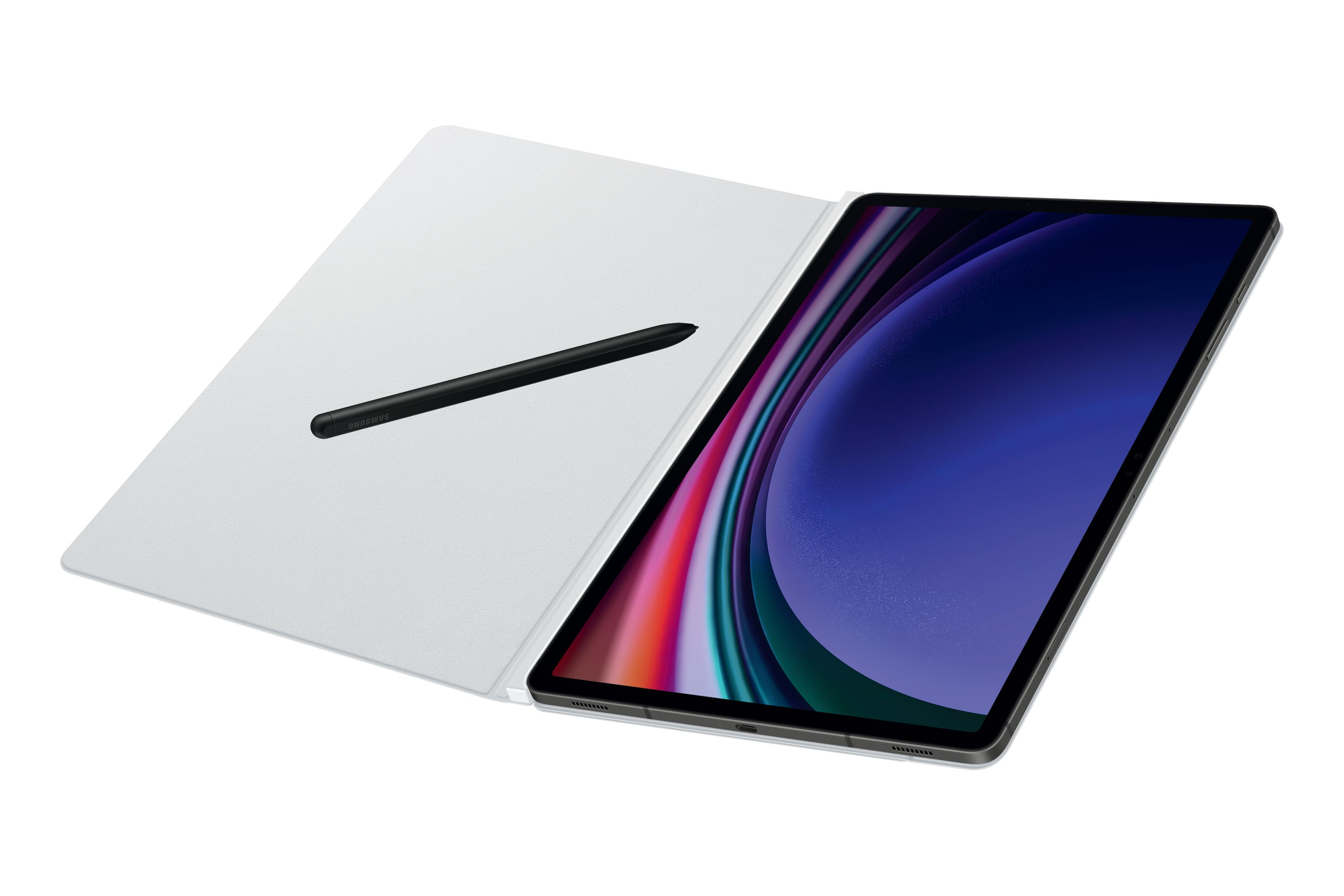 Tablet z czarnym rysikiem na białej okładce. Ekran wyświetla kolorowy, abstrakcyjny obraz.