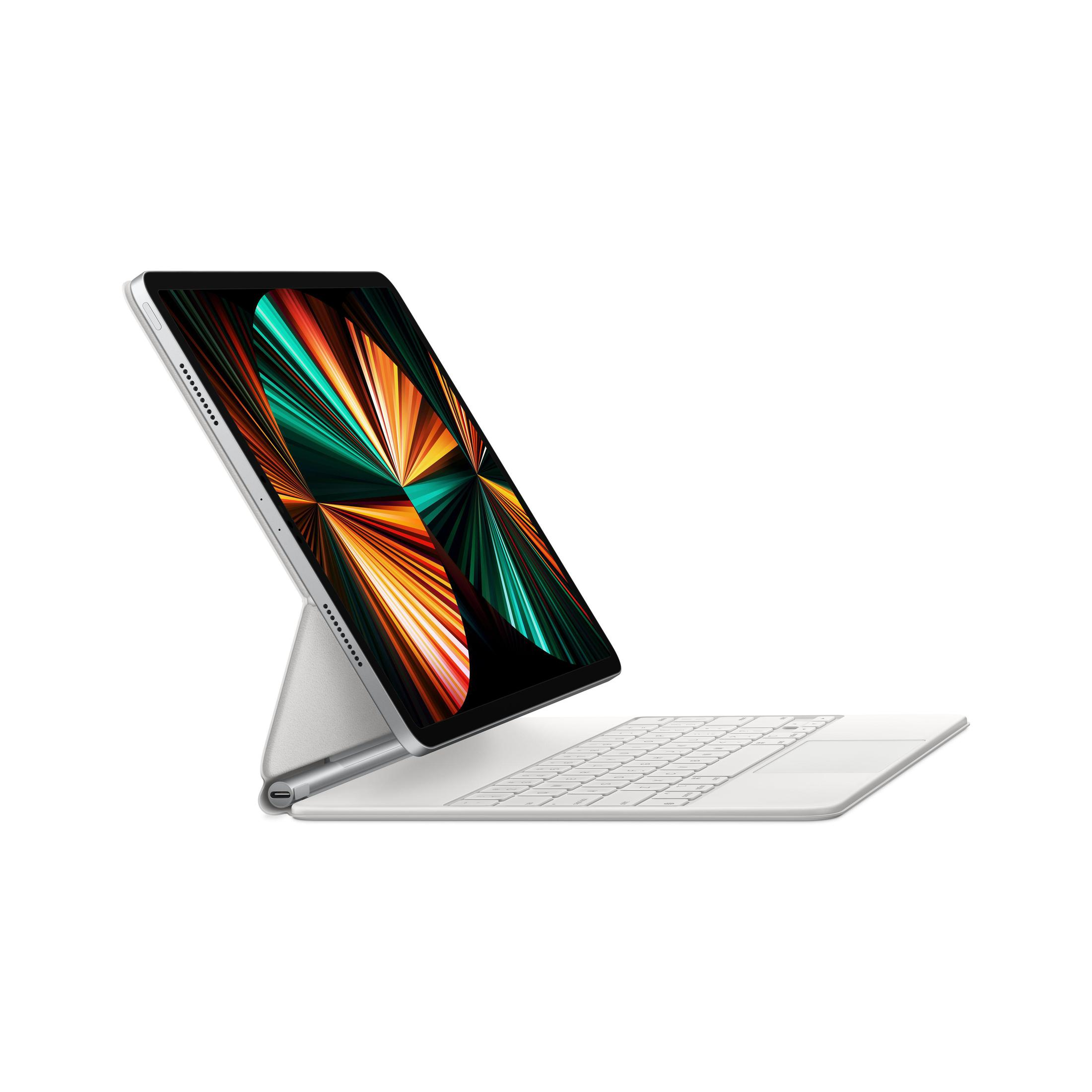 Tablet na białej klawiaturze. Ekran tabletu wyświetla abstrakcyjny wzór. Klawiatura jest podłączona.