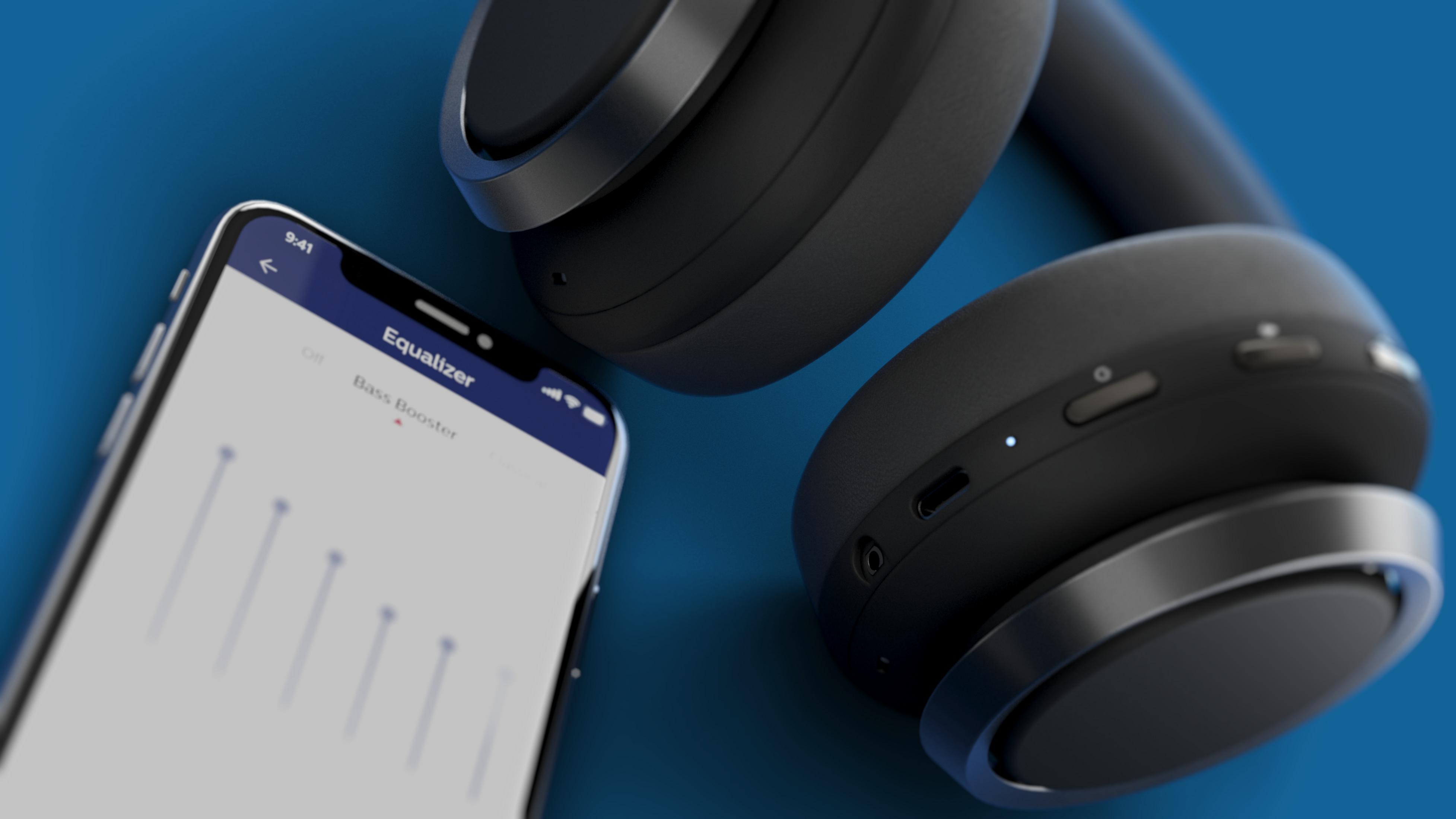 Schwarze Kopfhörer und ein Telefon. Telefon zeigt eine Equalizer-App auf blauem Hintergrund.