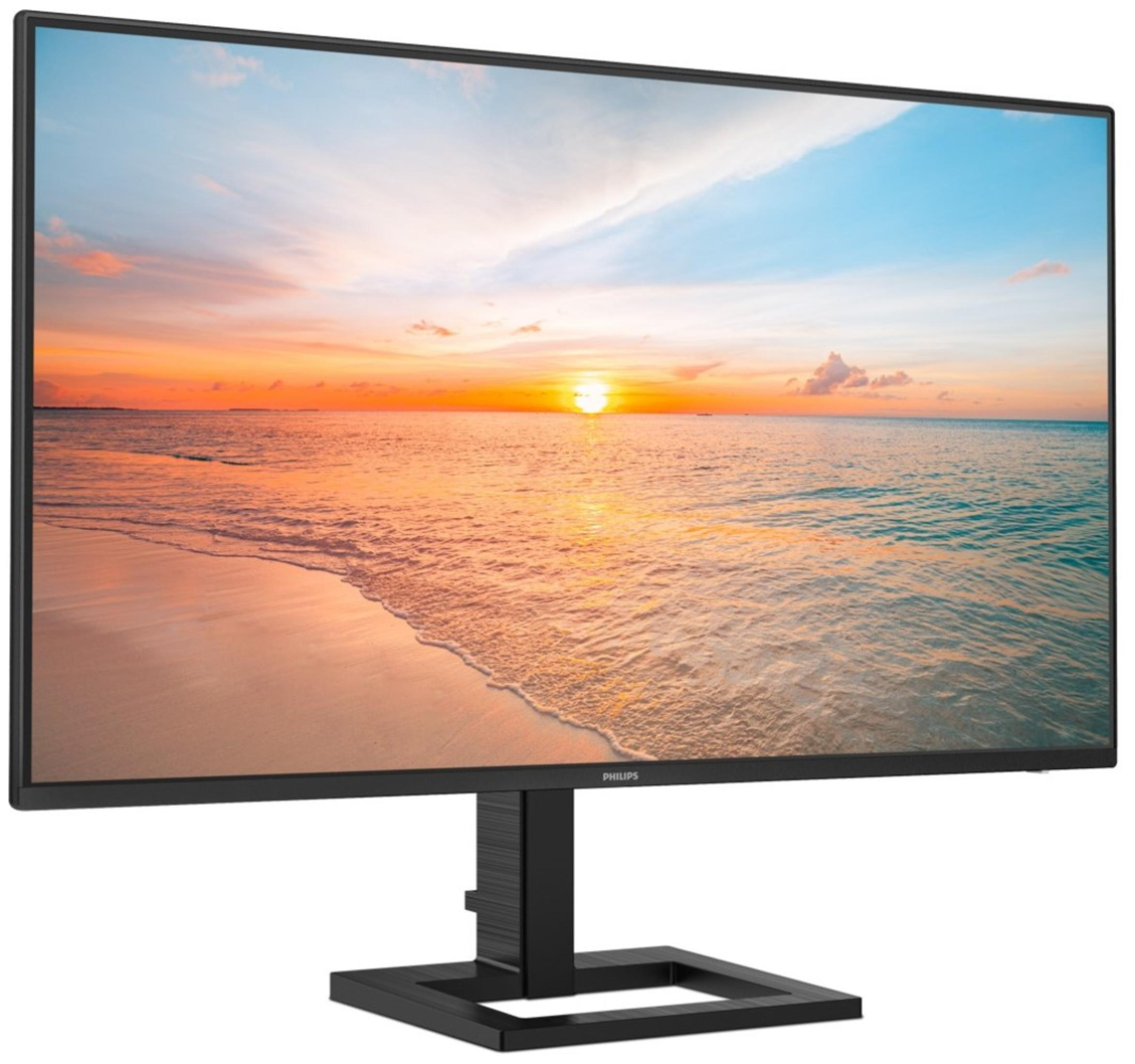 Monitor Philips wyświetla plażę o zachodzie słońca. Monitor ma czarną ramkę i podstawę.