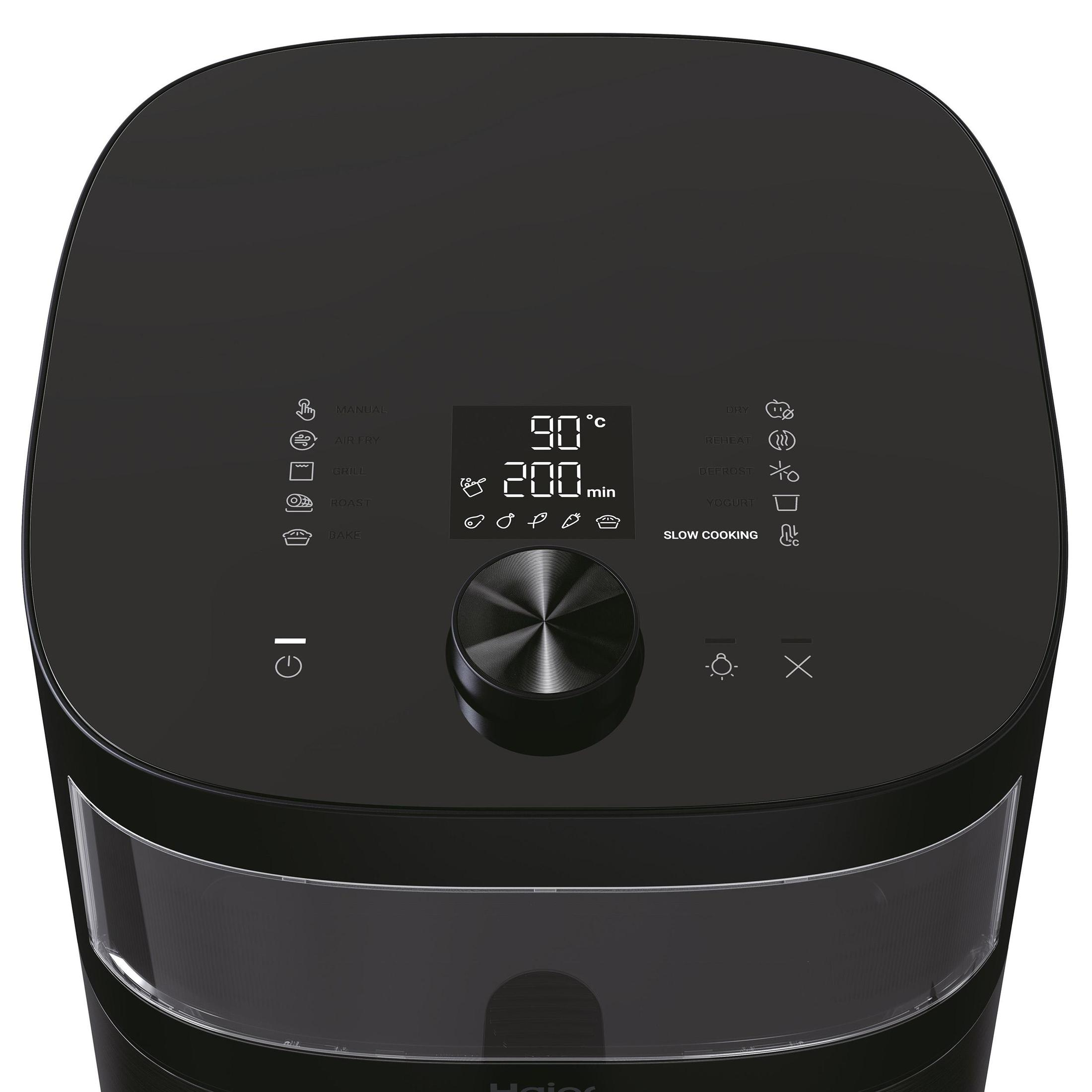 Biały monitor z czarnym urządzeniem przymocowanym z tyłu. Niebieskie paski kadrują scenę.