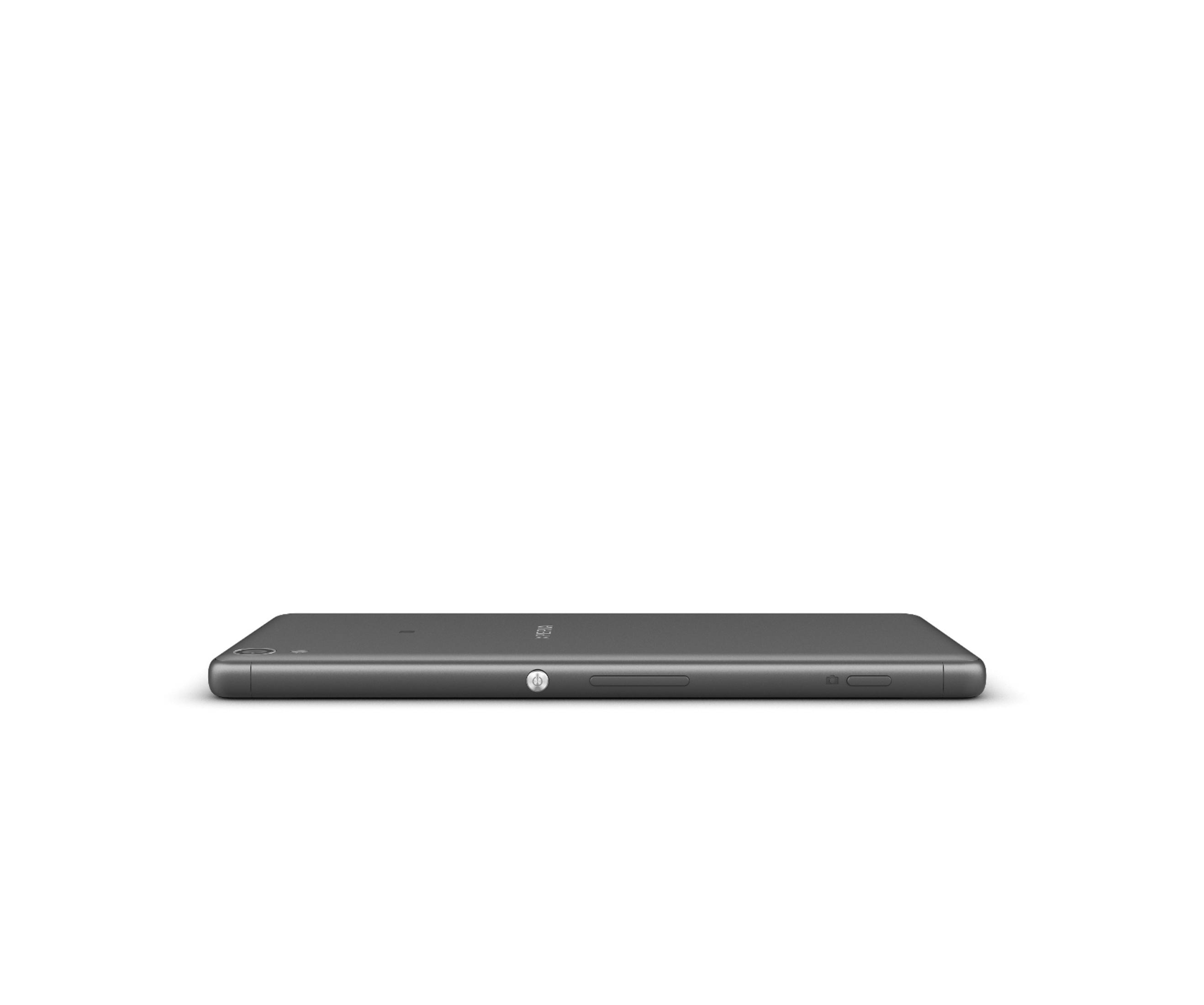 Ein schlankes, graues Tablet oder Telefon, das horizontal auf einer weißen Oberfläche liegt.