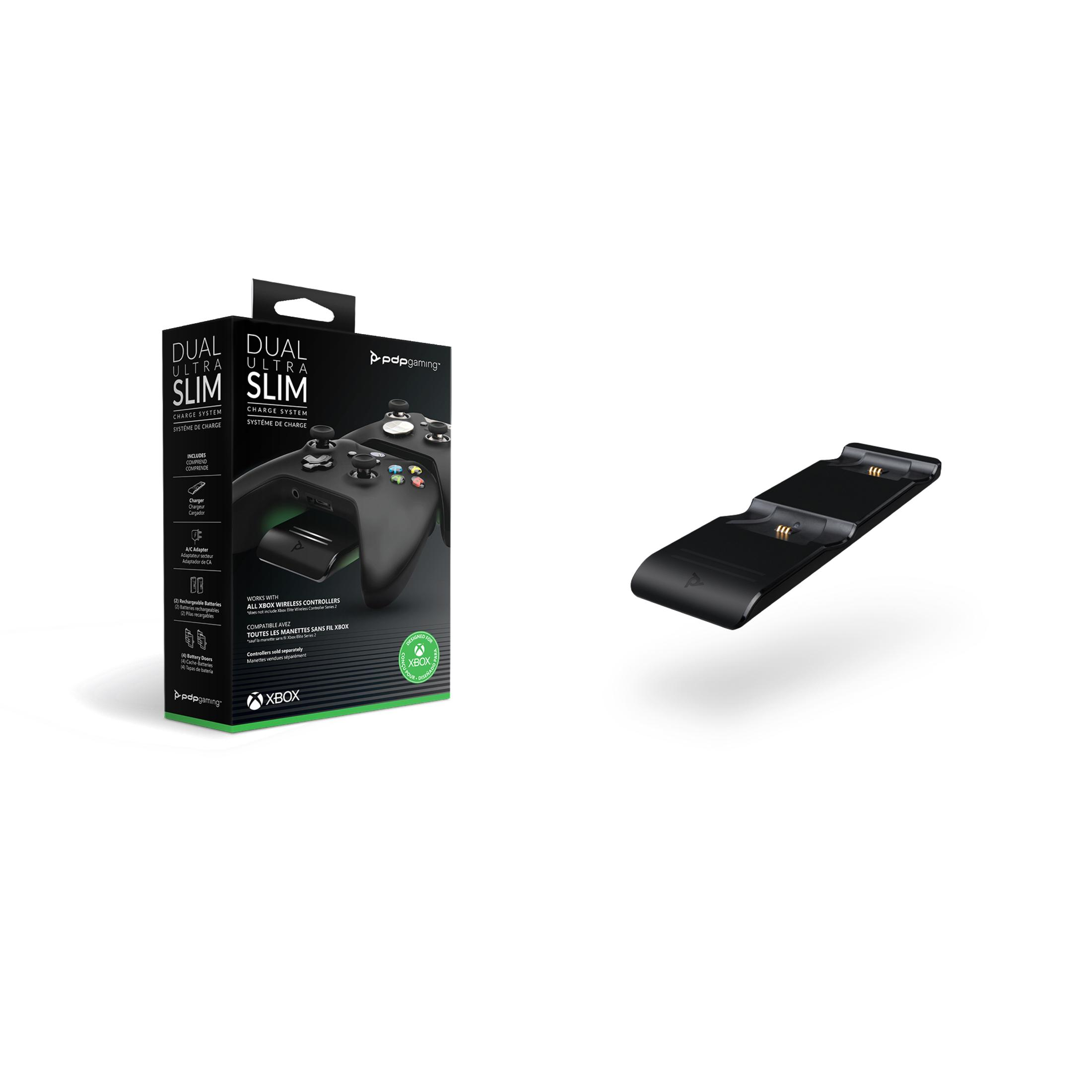 Czarna i zielona stacja ładująca kontrolera Xbox, z kontrolerem i pudełkiem w tle.