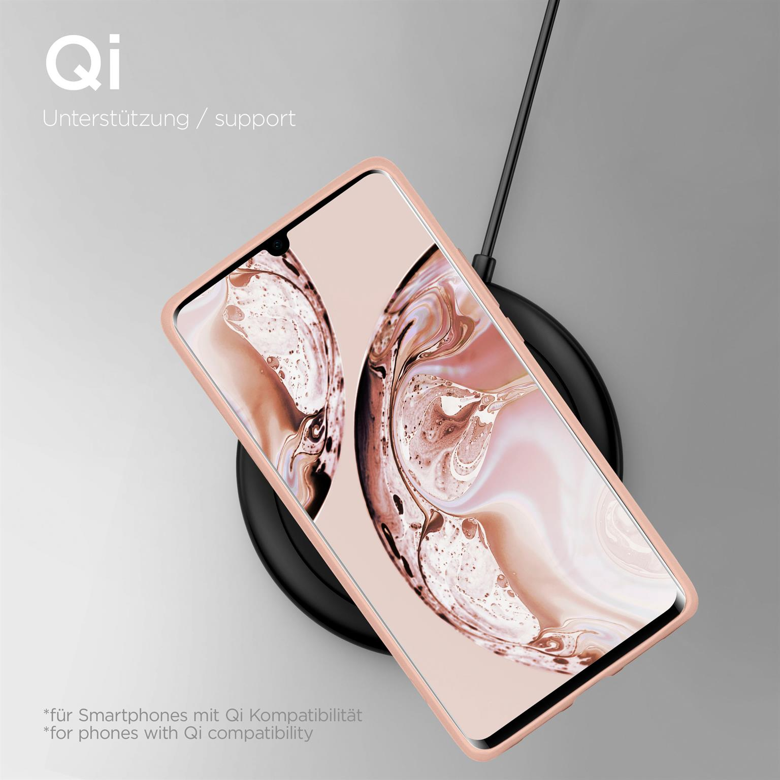 Telefon auf kabellosem Ladegerät. Rosa Hülle. Text: 'Qi' und 'Qi-Kompatibilität'. Ladesymbol auf dem Bildschirm.