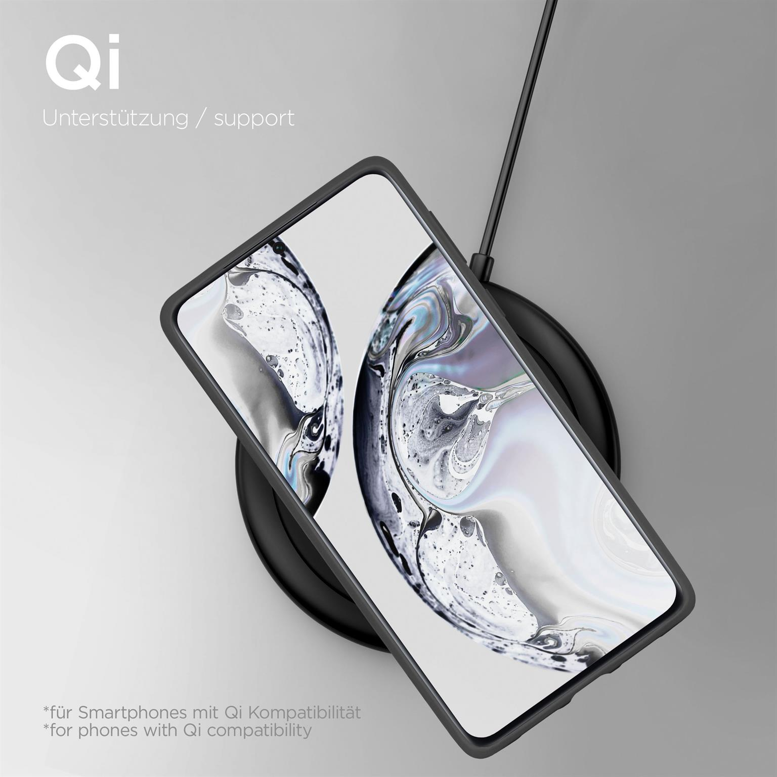 Ein Telefon auf einem kabellosen Ladegerät. Das Telefon ist schwarz und lädt.