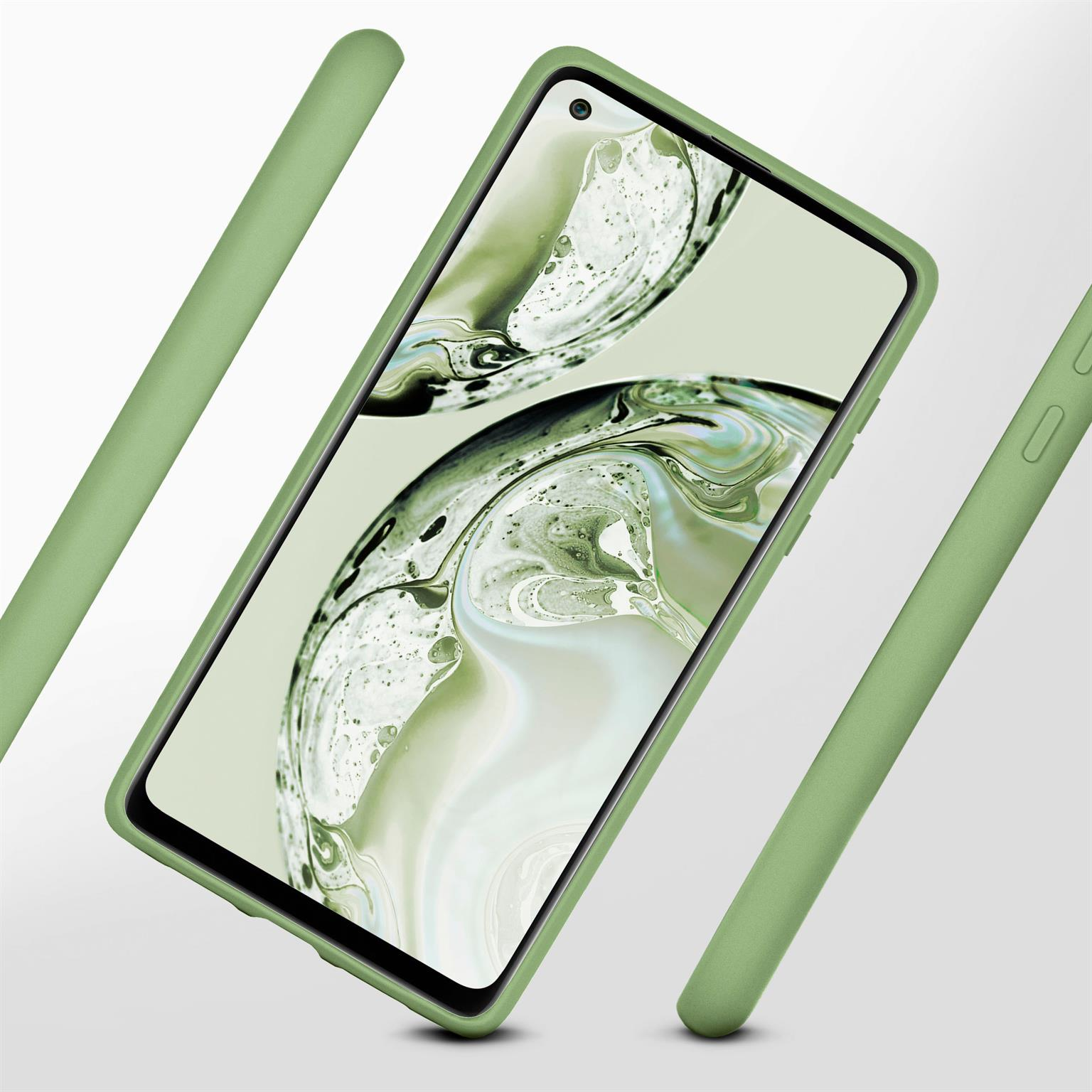 Ein grünes Telefon in einer grünen Hülle. Mehrere grüne Gehäuseteile um das Telefon.