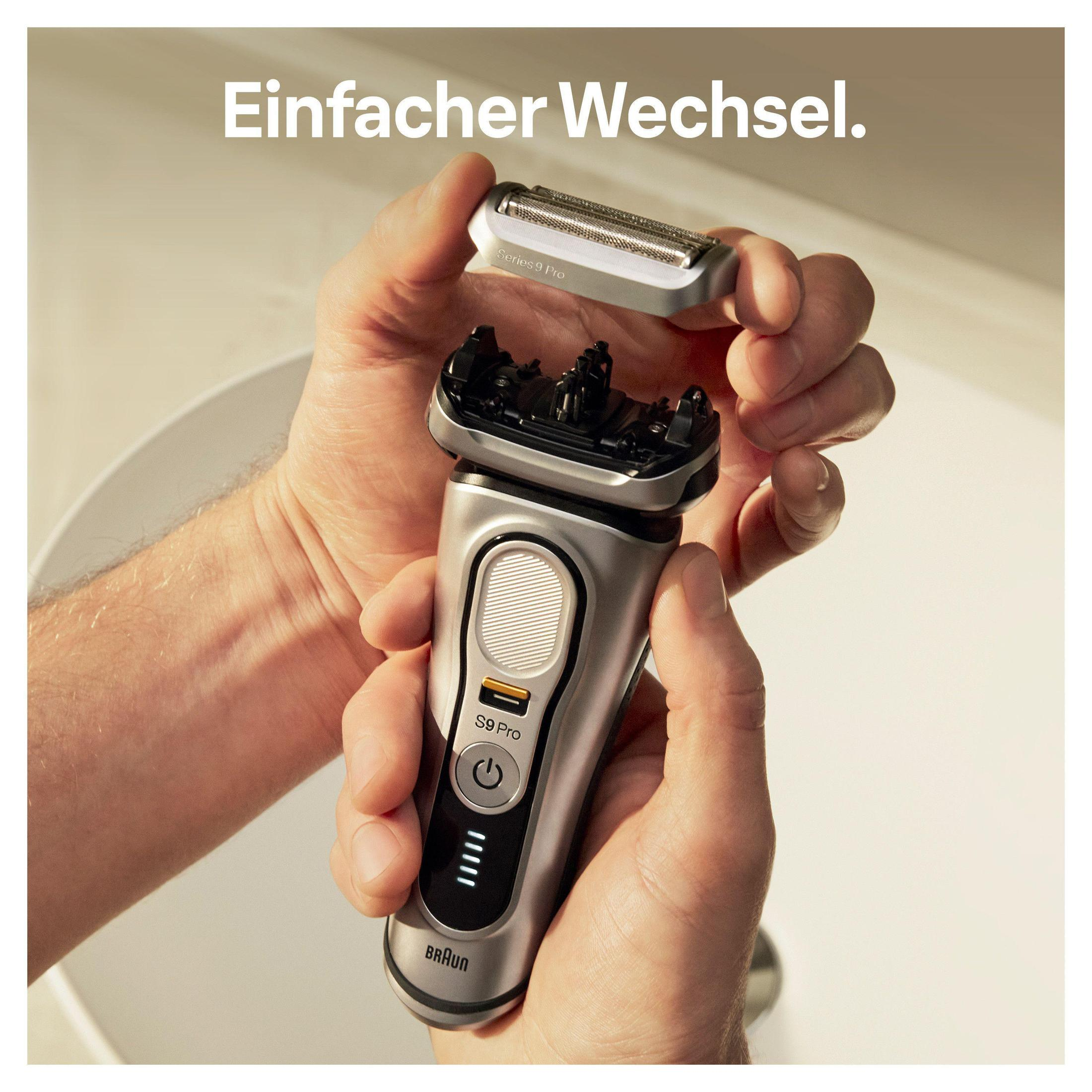 Hände ersetzen Rasiererkopf. Braun Series 9 Pro und der neue Kopf.