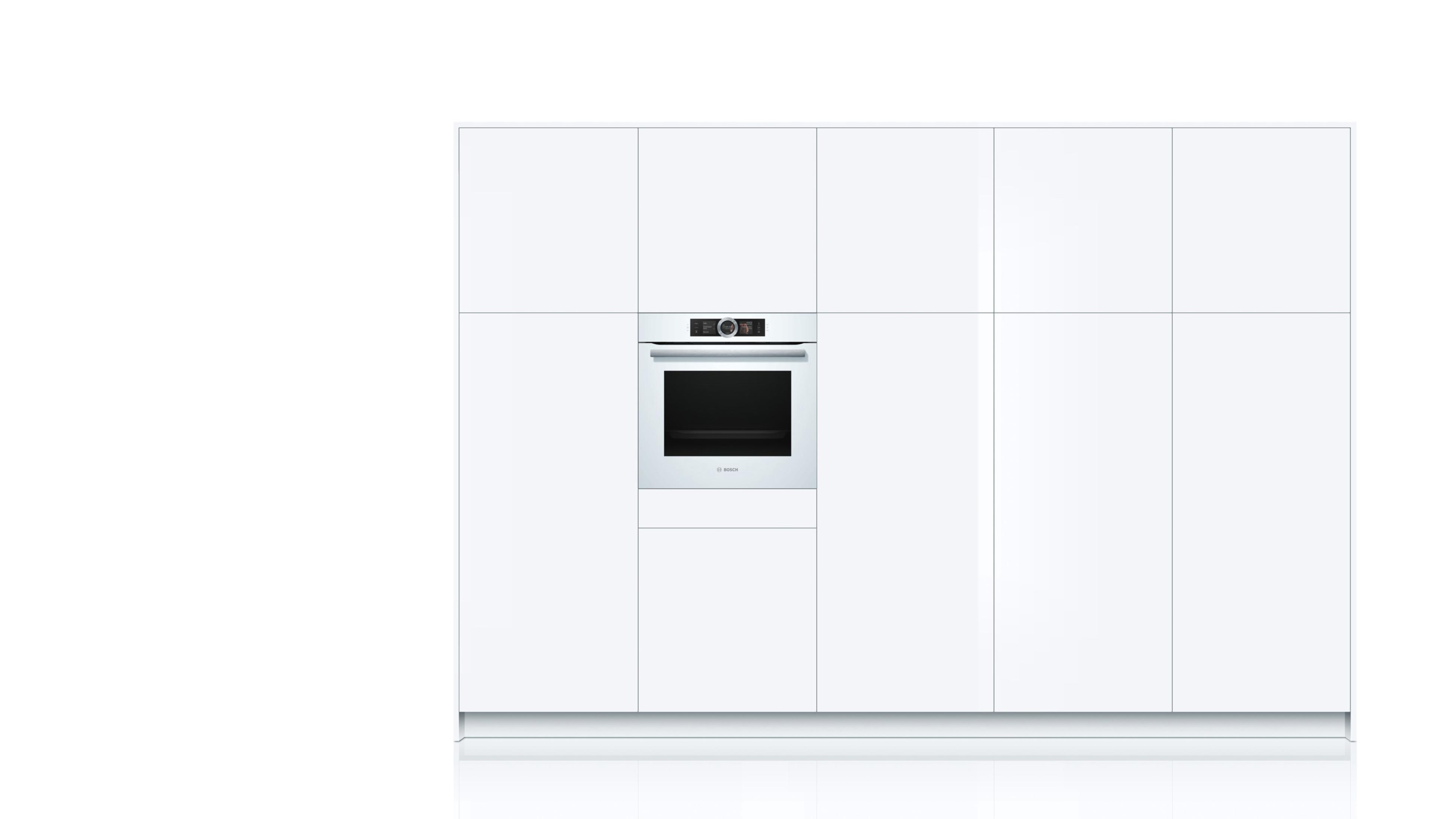 Horno empotrado blanco en un armario de cocina blanco.