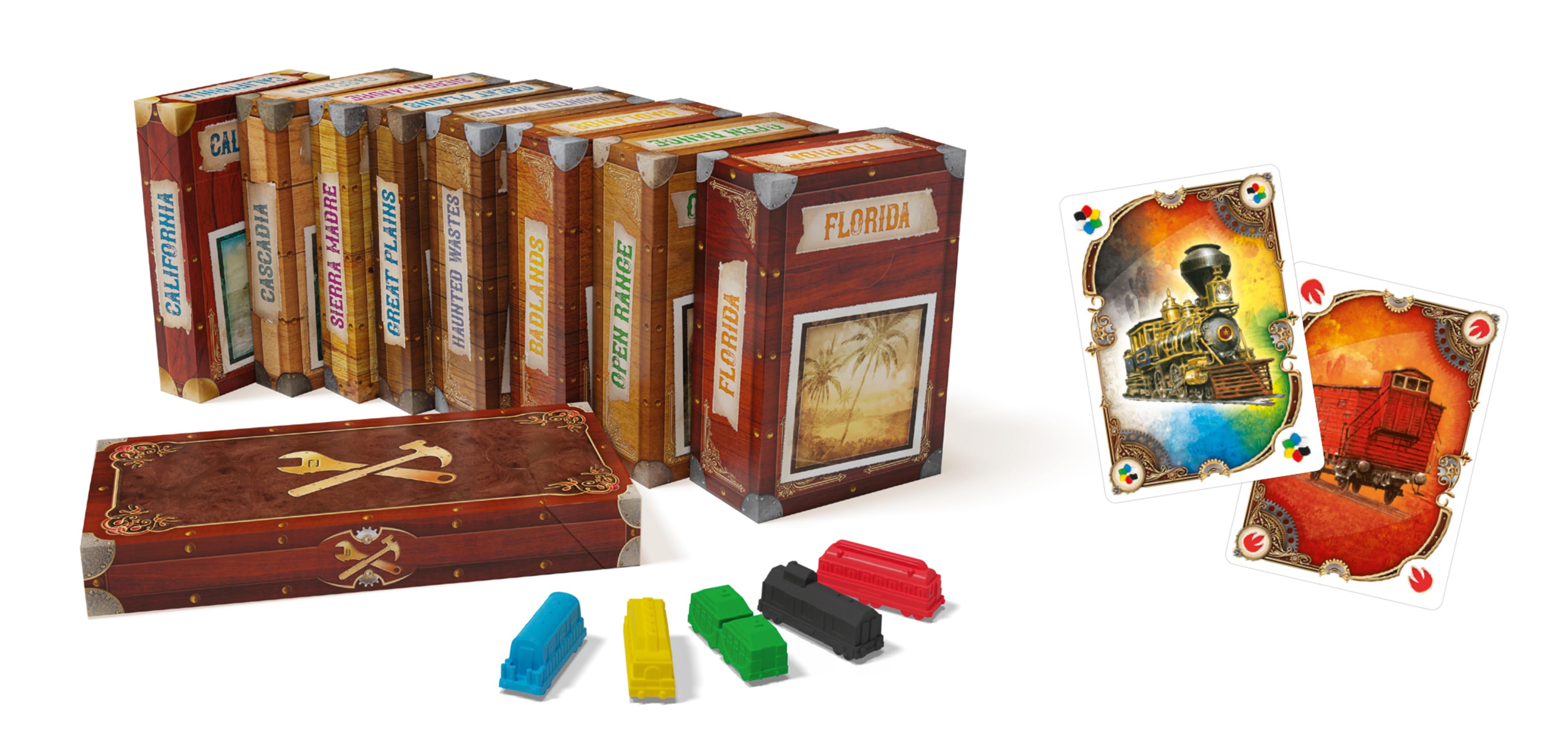 Brettspielboxen mit Etiketten, Zugkarten und Zugwaggons vor weißem Hintergrund.