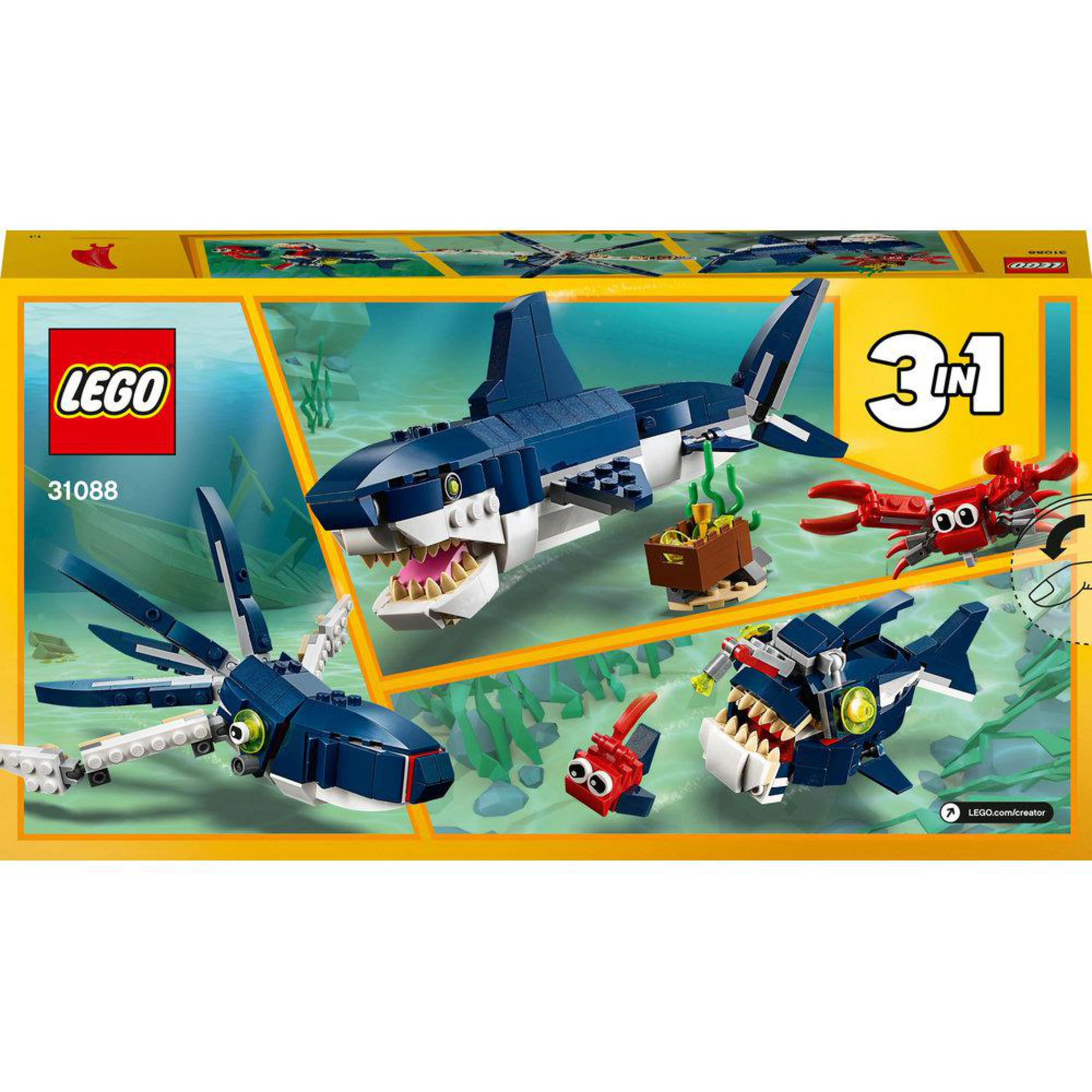 Pudełko LEGO z modelami rekinów. Zawiera dużego rekina, kałamarnicę i inne stworzenia morskie, wszystko w środowisku morskim.