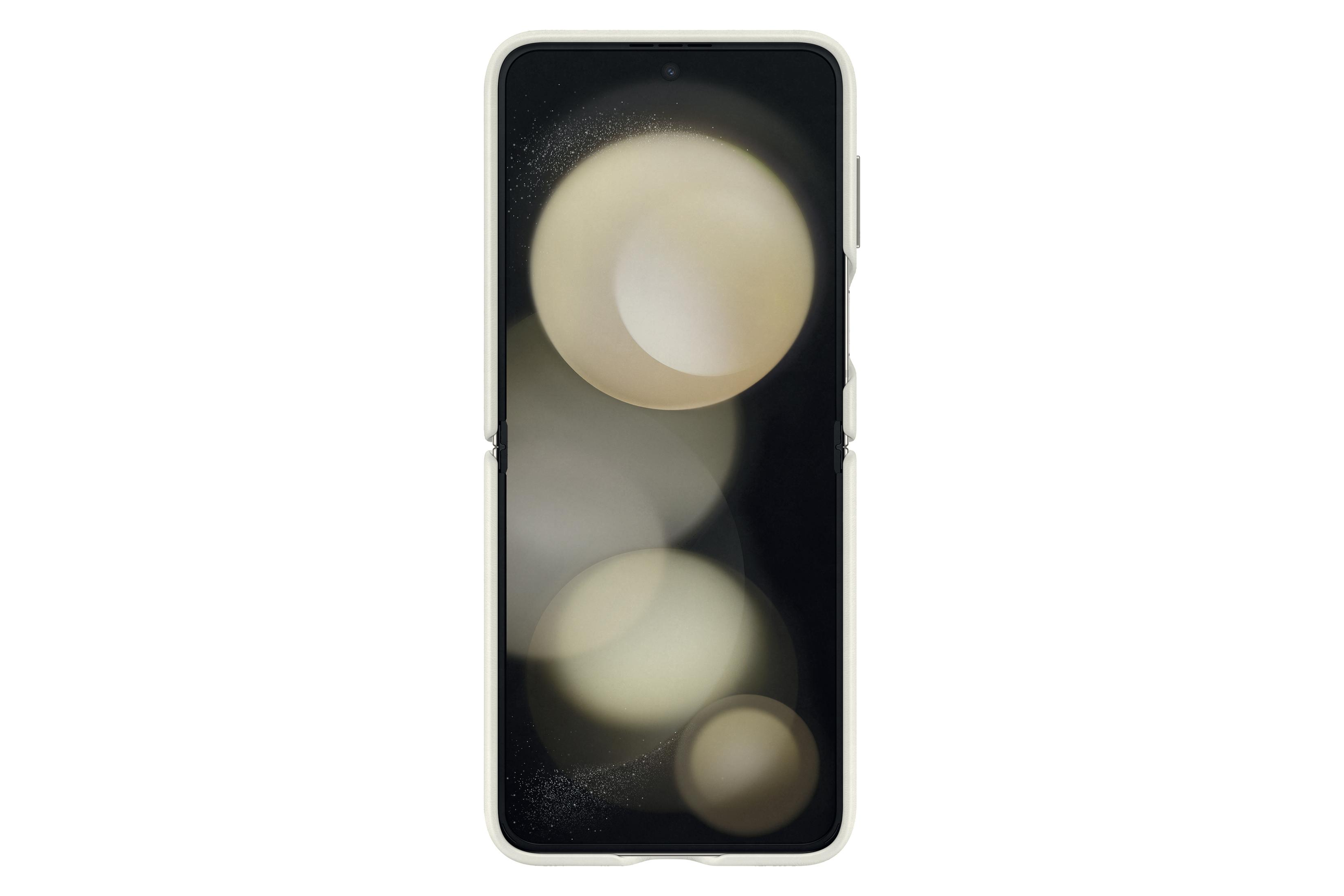 L'écran du smartphone affiche un arrière-plan flou avec des cercles lumineux. Le téléphone est blanc.