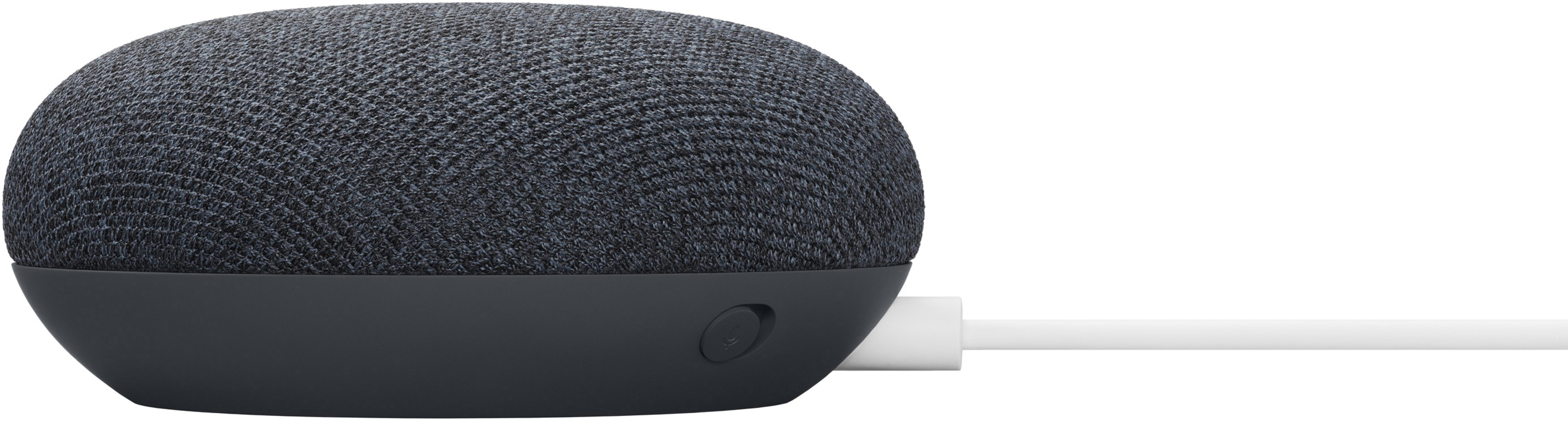 Un altoparlante Google Nest Mini grigio scuro con un cavo di alimentazione bianco. Poggia su una superficie bianca.